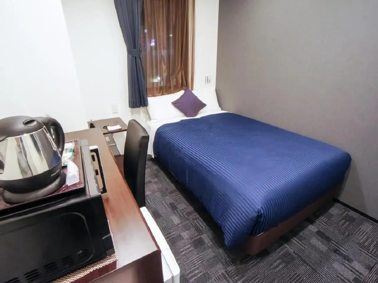 Bed in HOTEL LiVEMAX Nagoya Sakae East Bed in HOTEL LiVEMAX Nagoya Sakae East