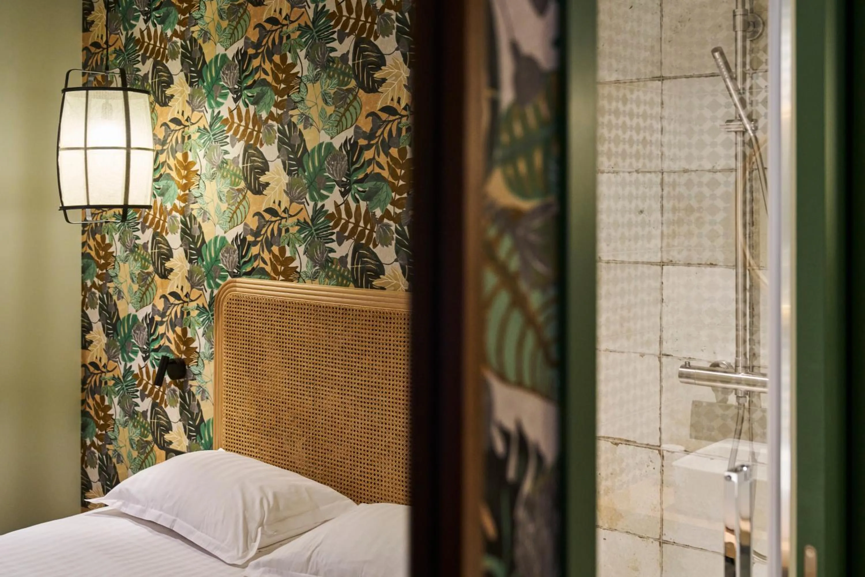 Decorative detail, Bed in Hôtel le Corbusson Laval Ouest