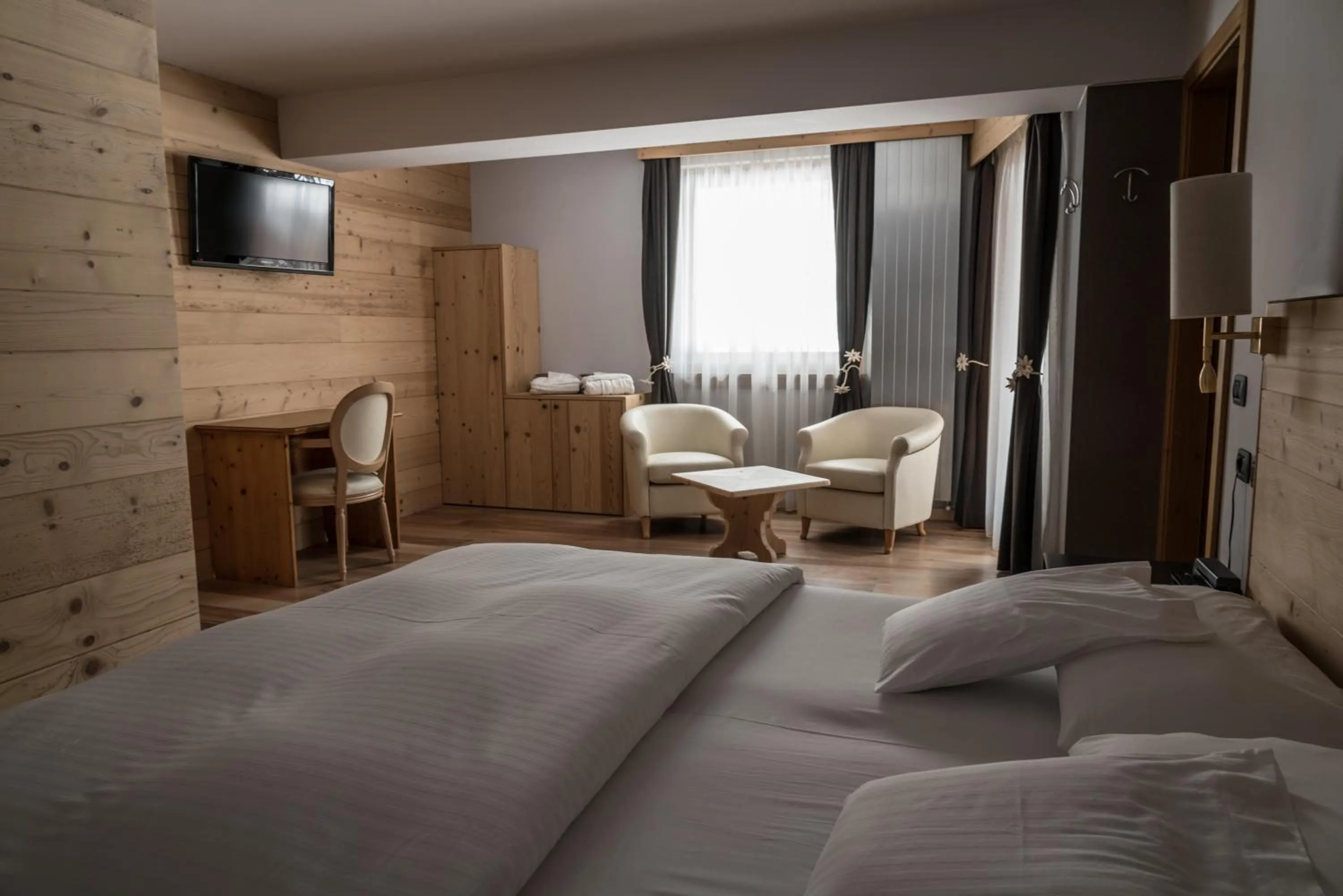 Bed in Chalet Laura Lodge Hotel