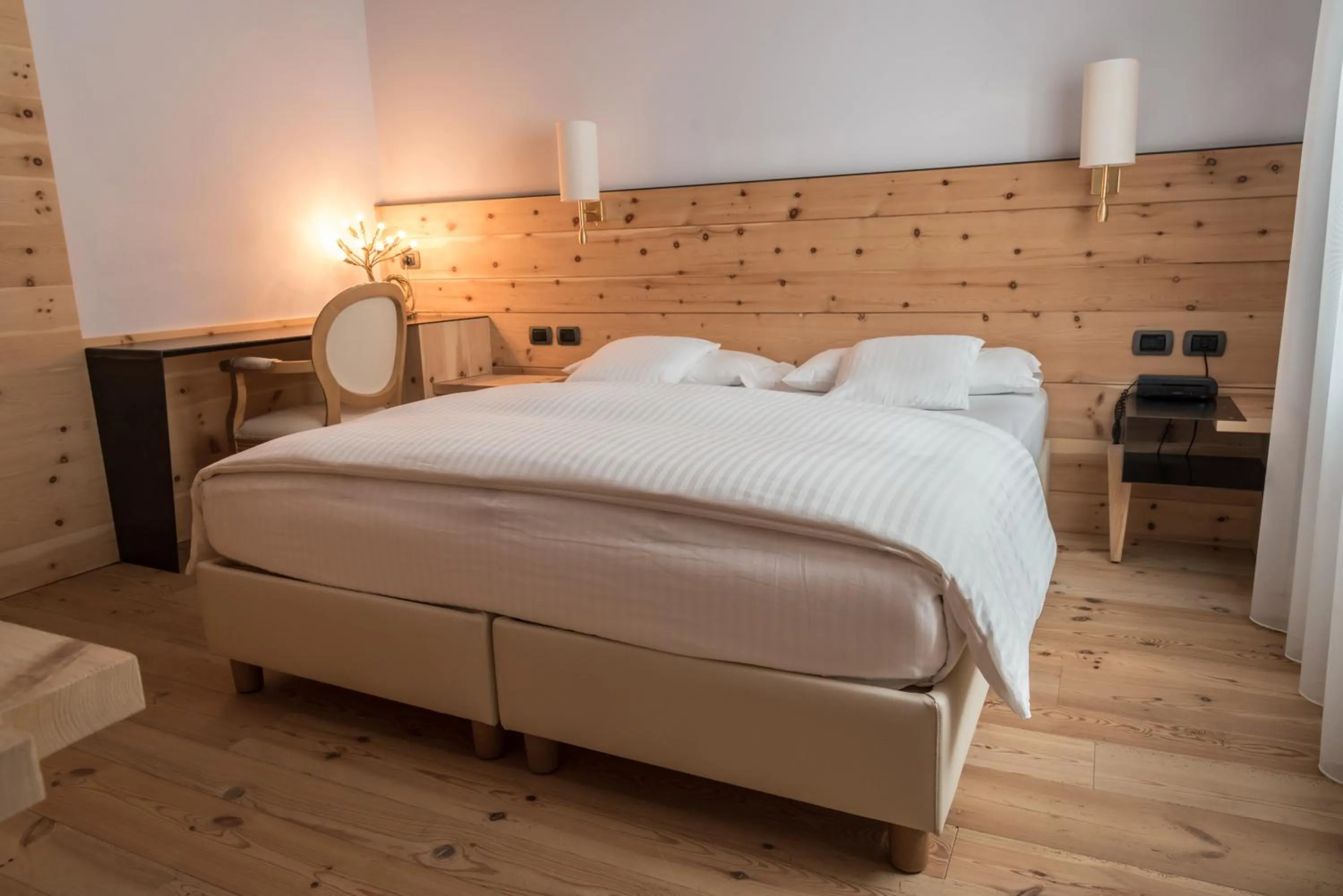 Bed in Chalet Laura Lodge Hotel