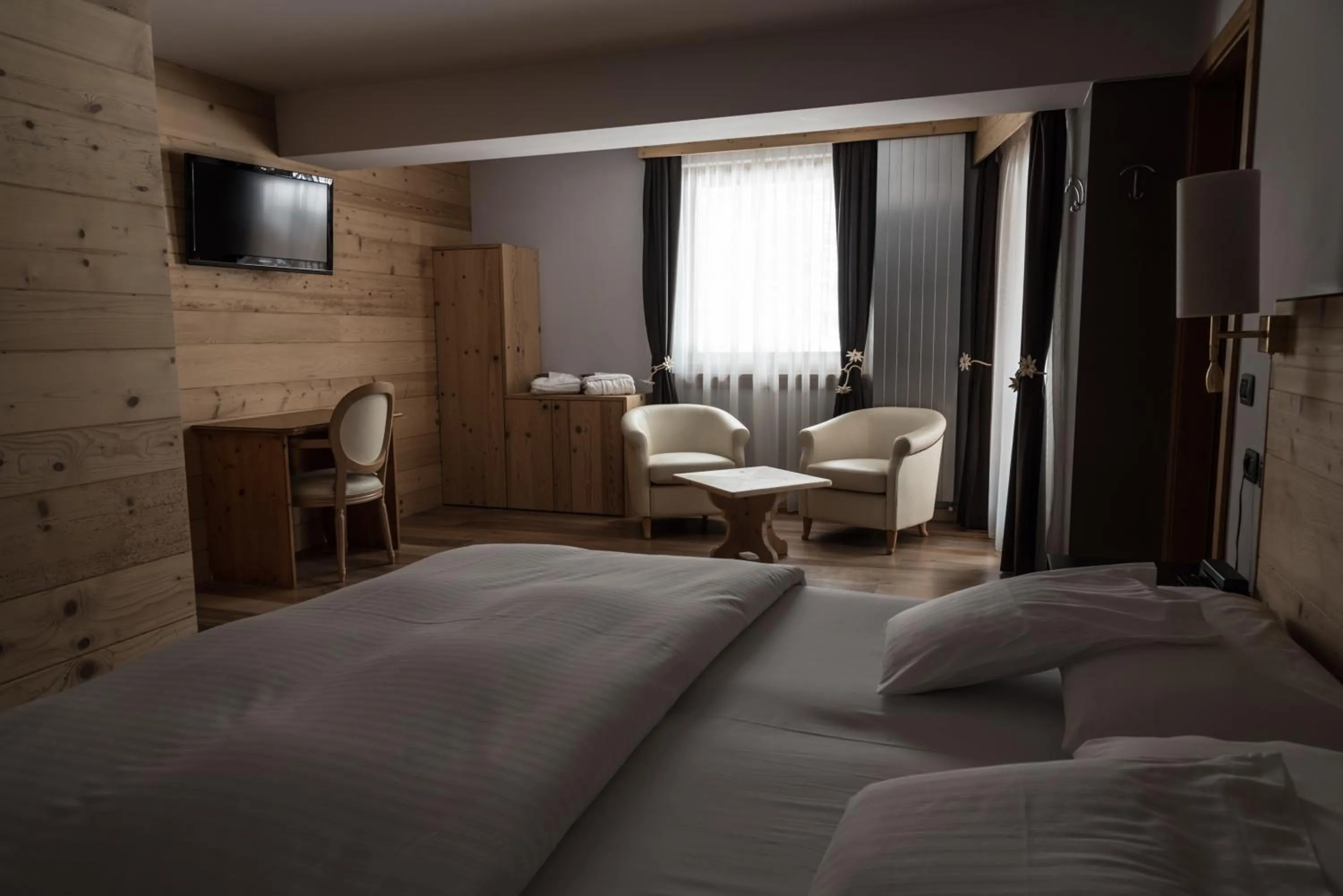 Bed in Chalet Laura Lodge Hotel
