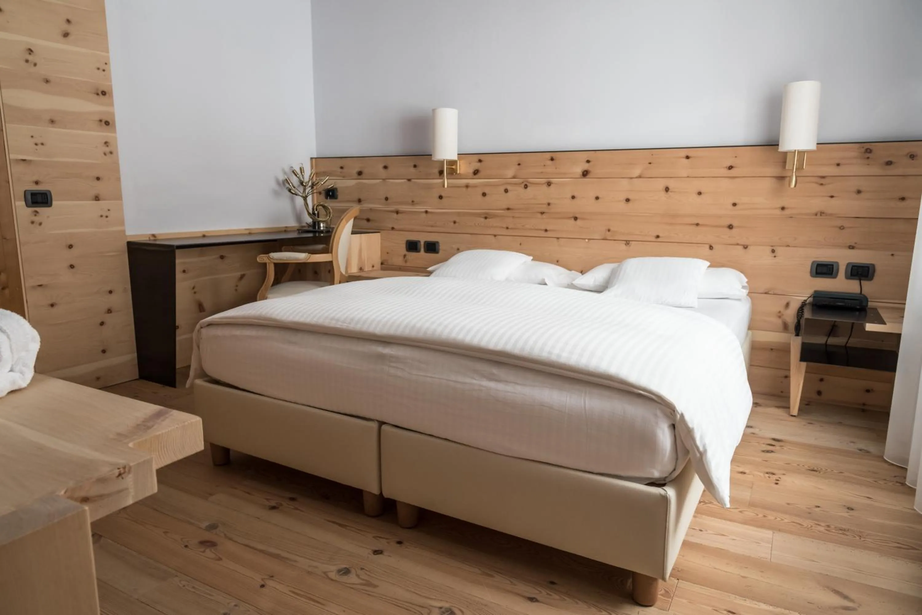 Bed in Chalet Laura Lodge Hotel