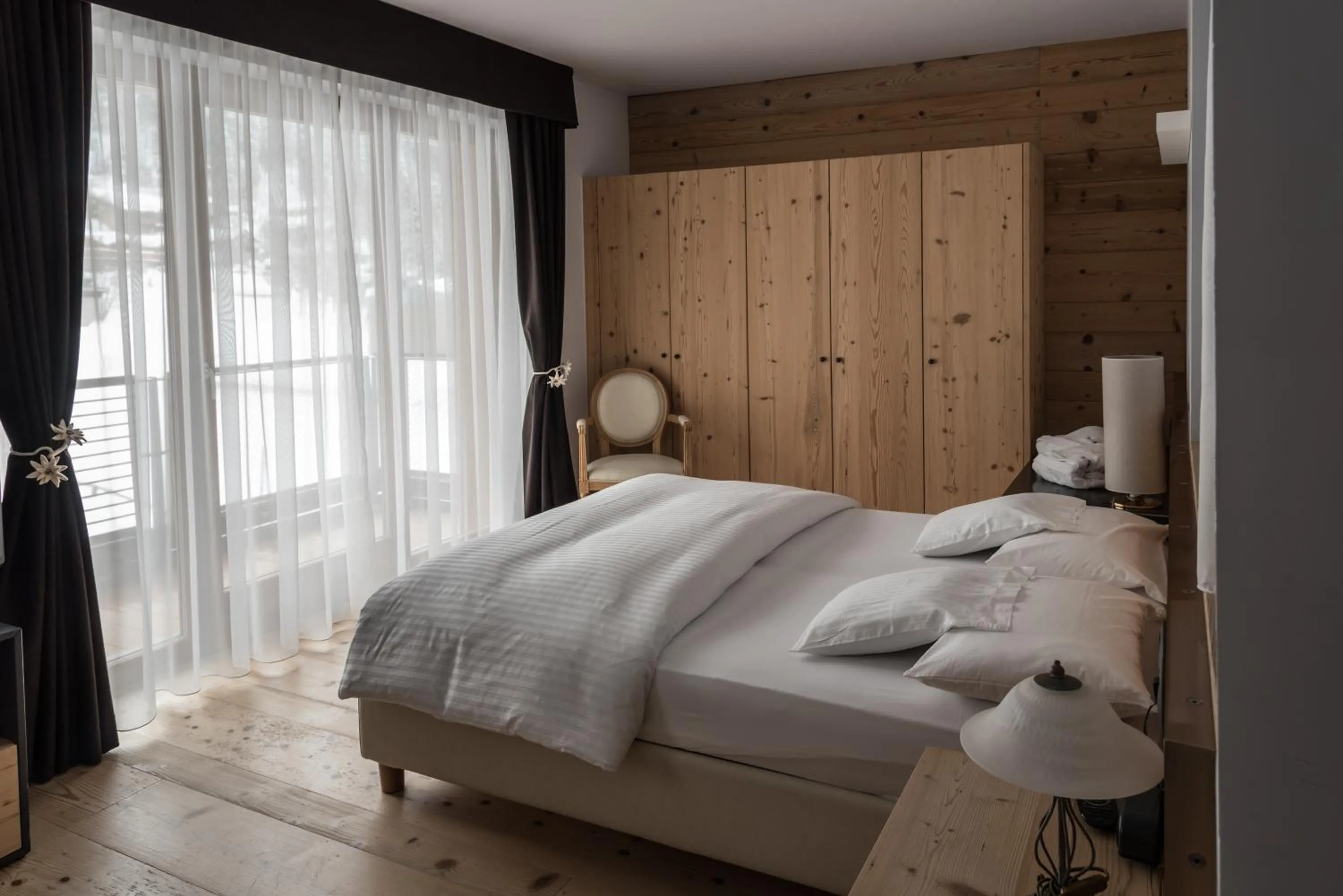 Bed in Chalet Laura Lodge Hotel