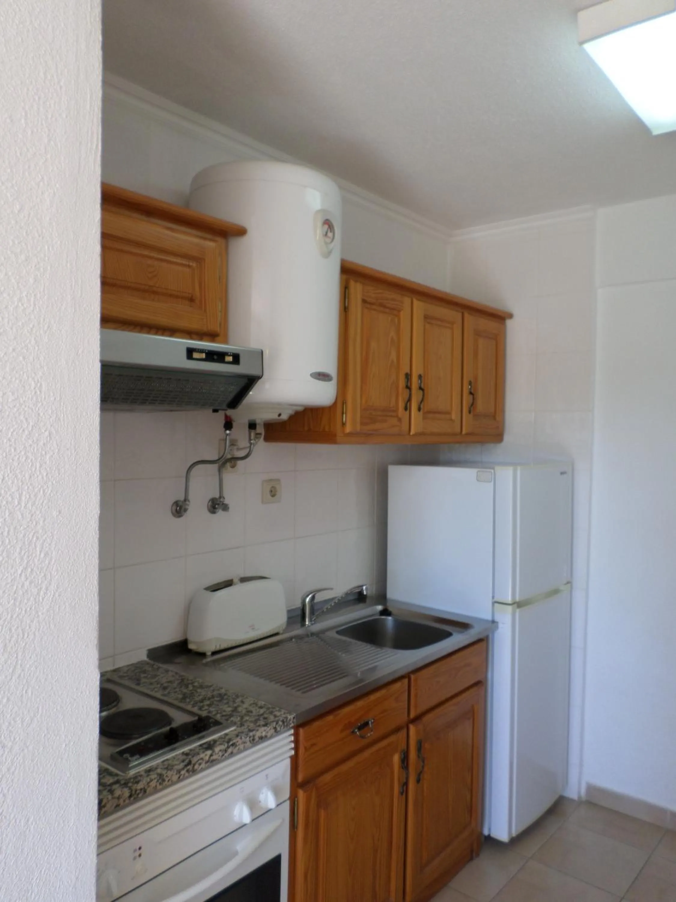 Kitchen or kitchenette in Parque Mourabel, Oásis Village & Pé do Lago