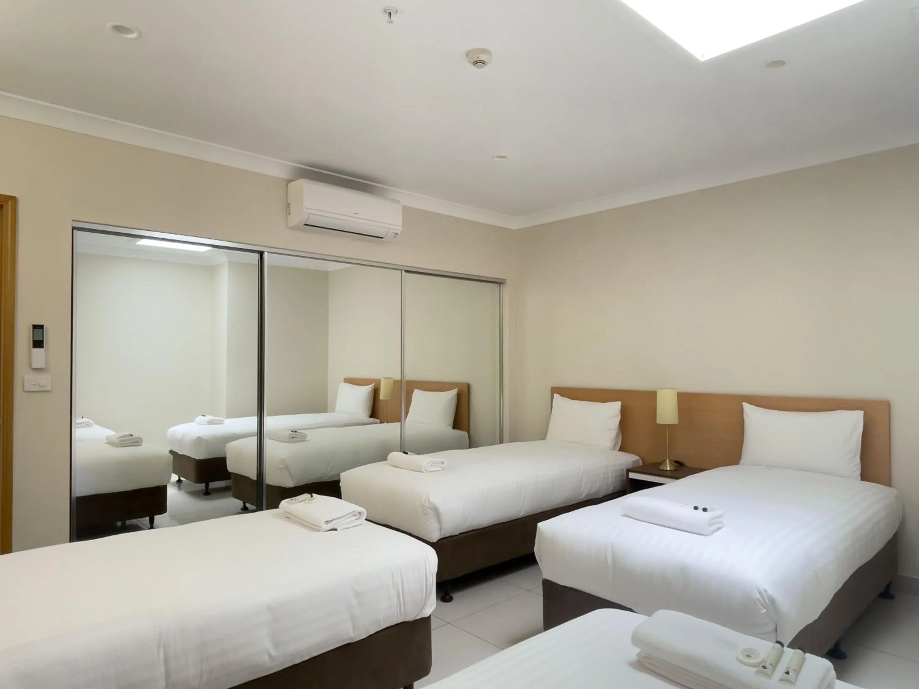 Bed in The Phoenix Artesian Spa Resort and Accommodation