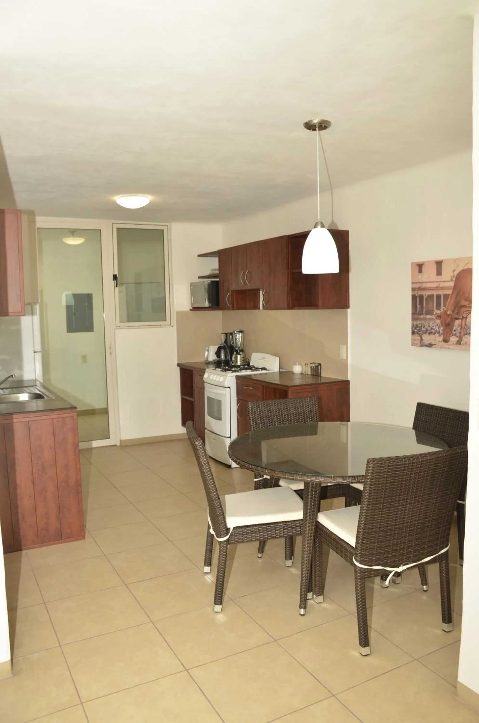 Kitchen or kitchenette in Zenharmony Suites