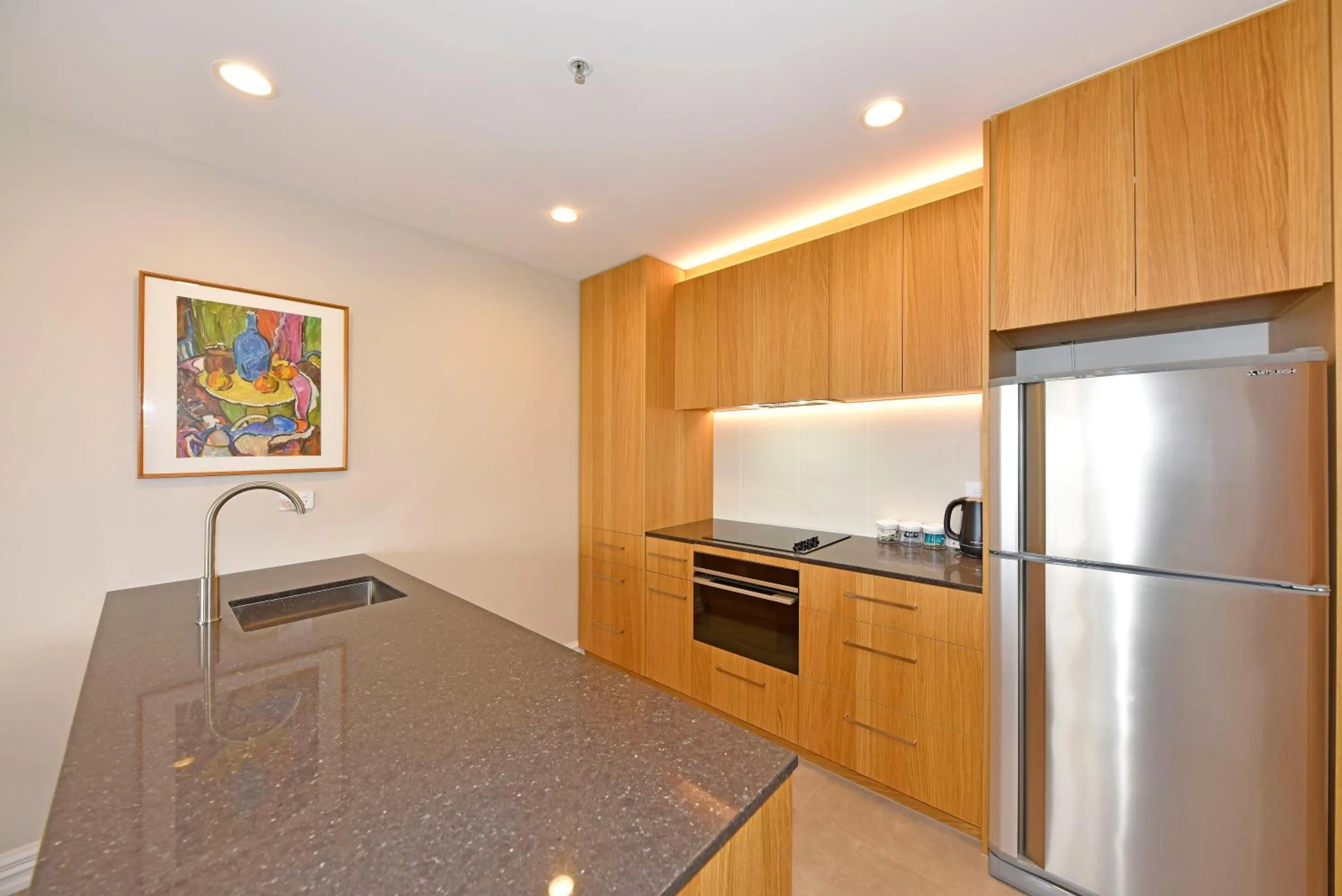 Kitchen or kitchenette in West Fitzroy Apartments