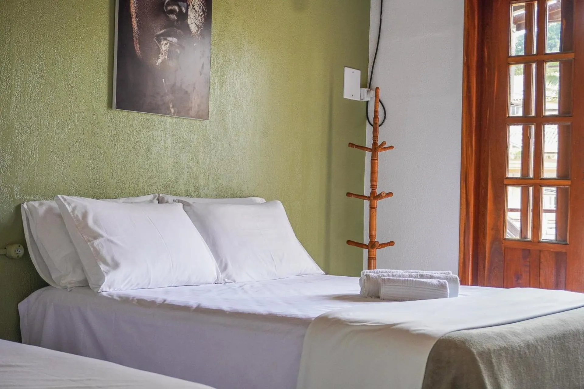 Bed in Pousada da praça