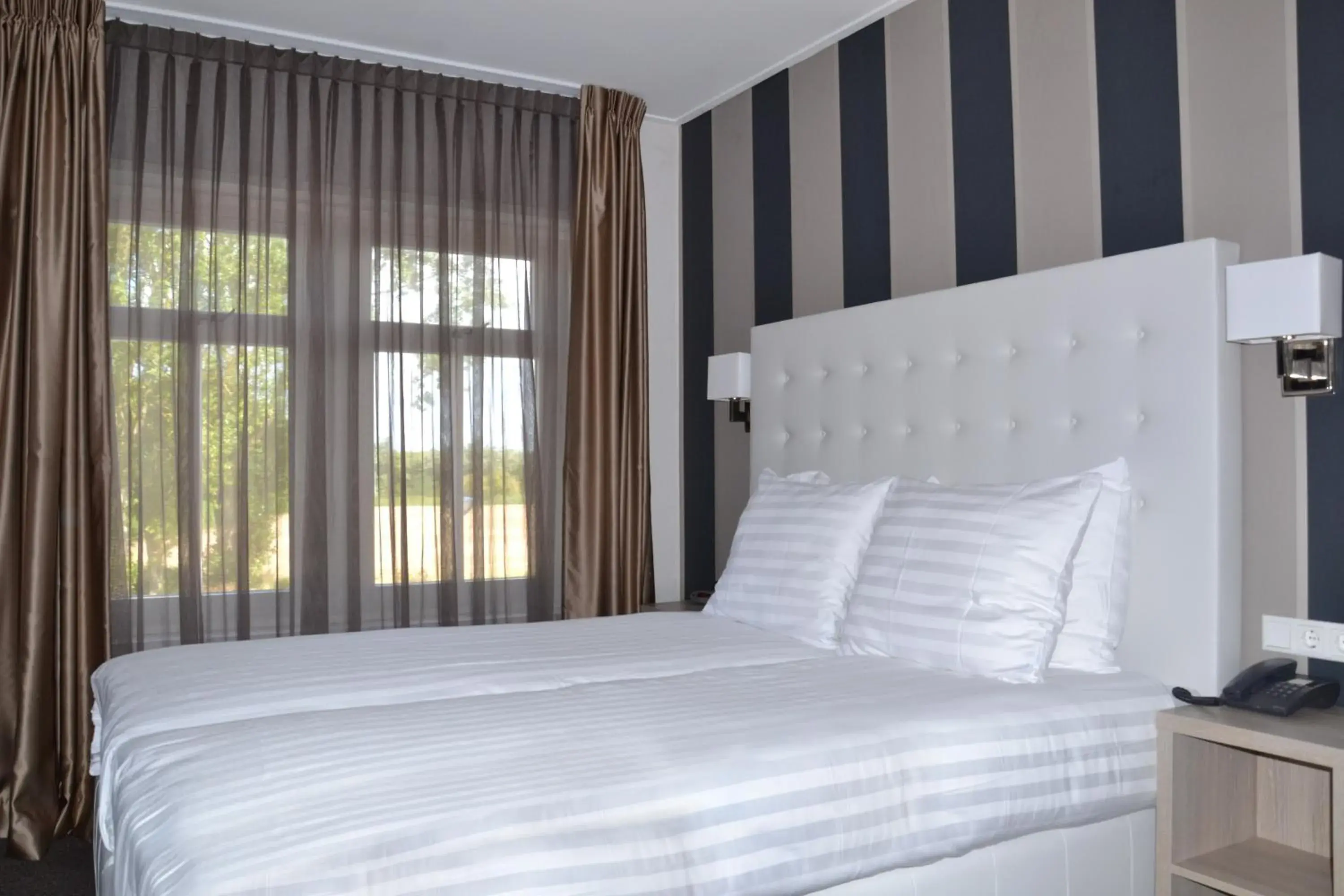 Bed in Fletcher Hotel-Restaurant Duinzicht Bed in Fletcher Hotel-Restaurant Duinzicht