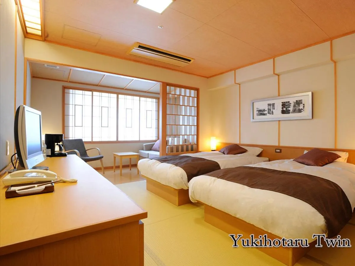 Bed in Hotel Taisetsu Onsen&Canyon Resort