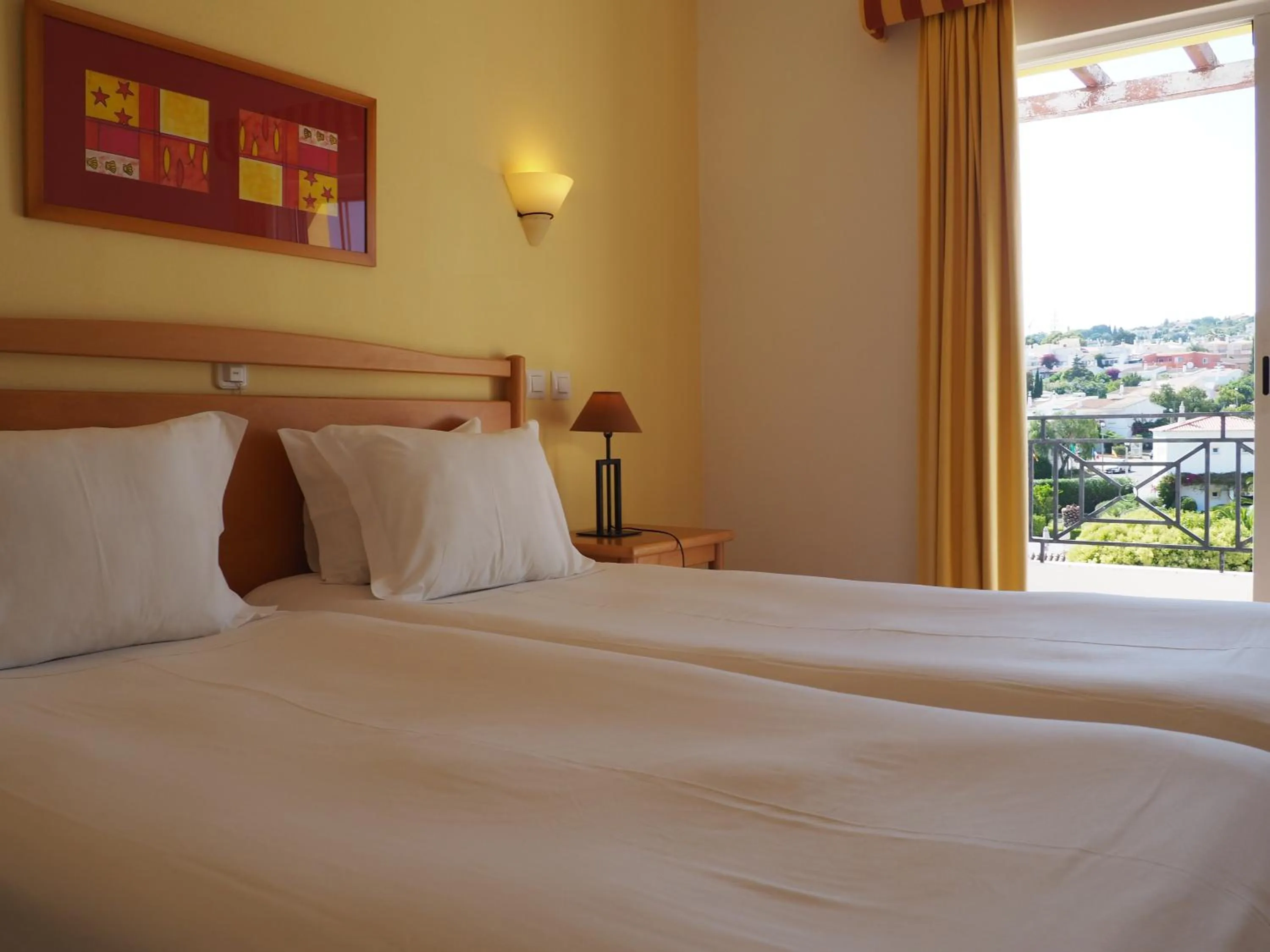 Bed in Luz Bay Hotel