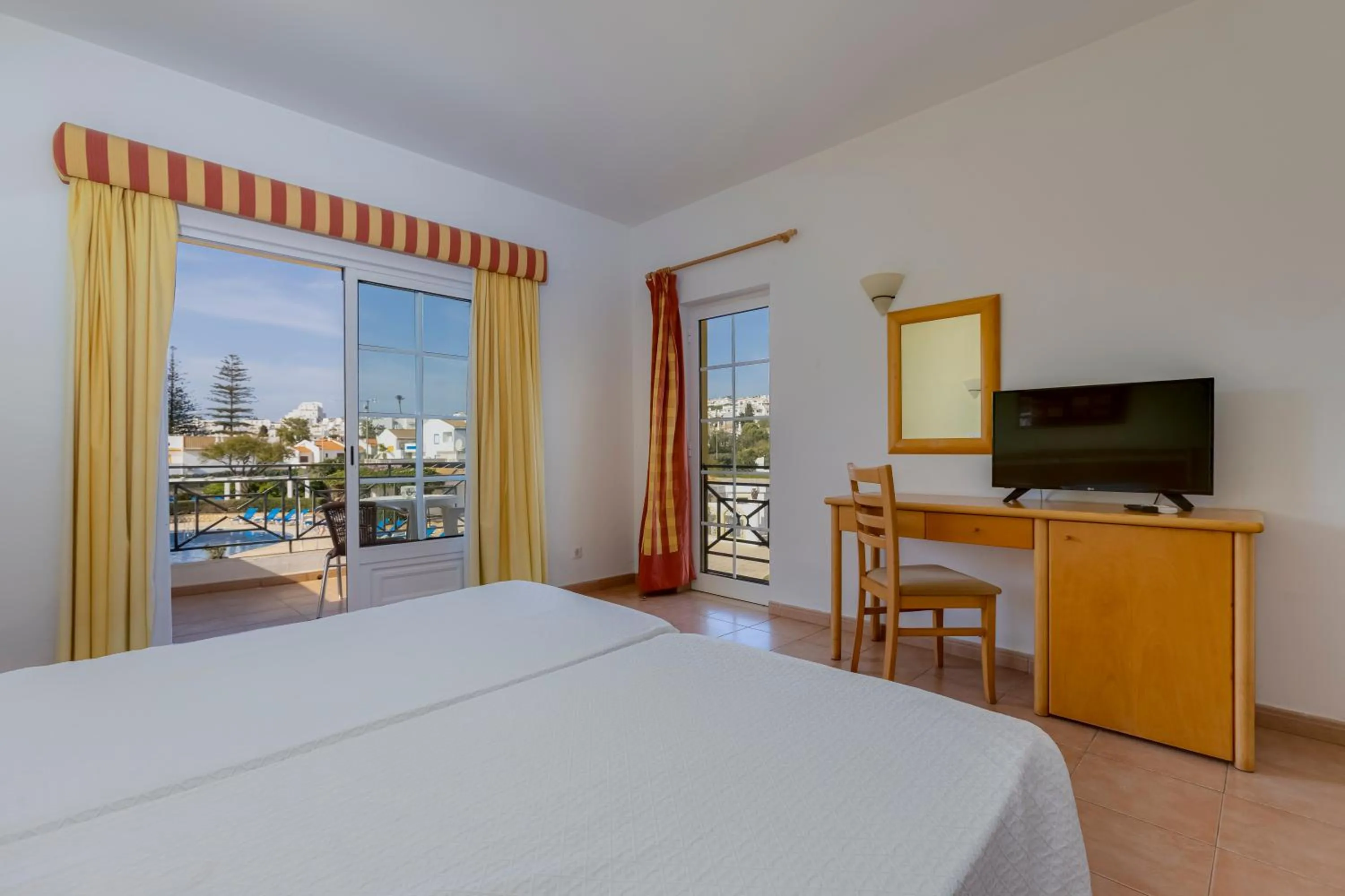 Bed in Luz Bay Hotel