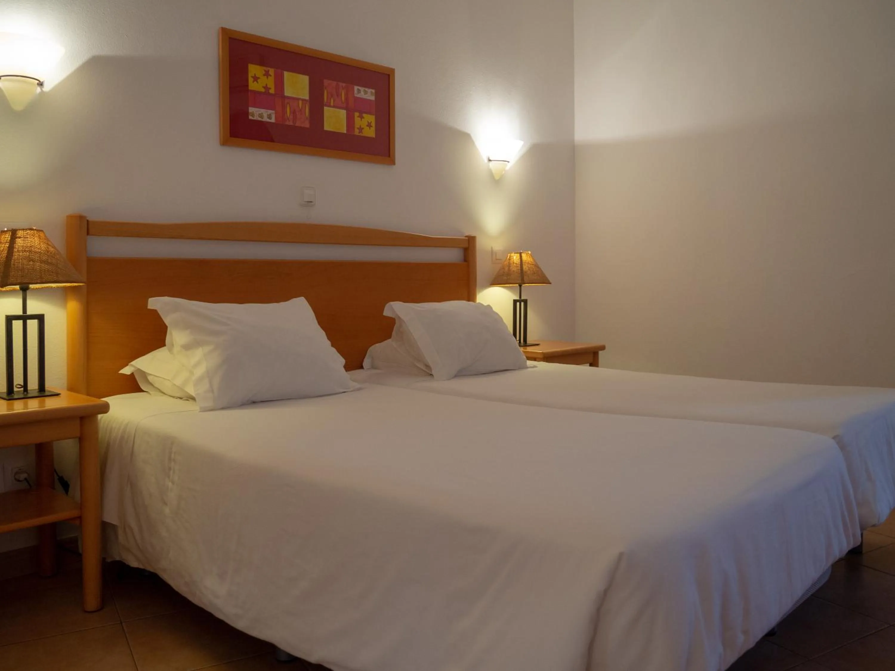 Bed in Luz Bay Hotel