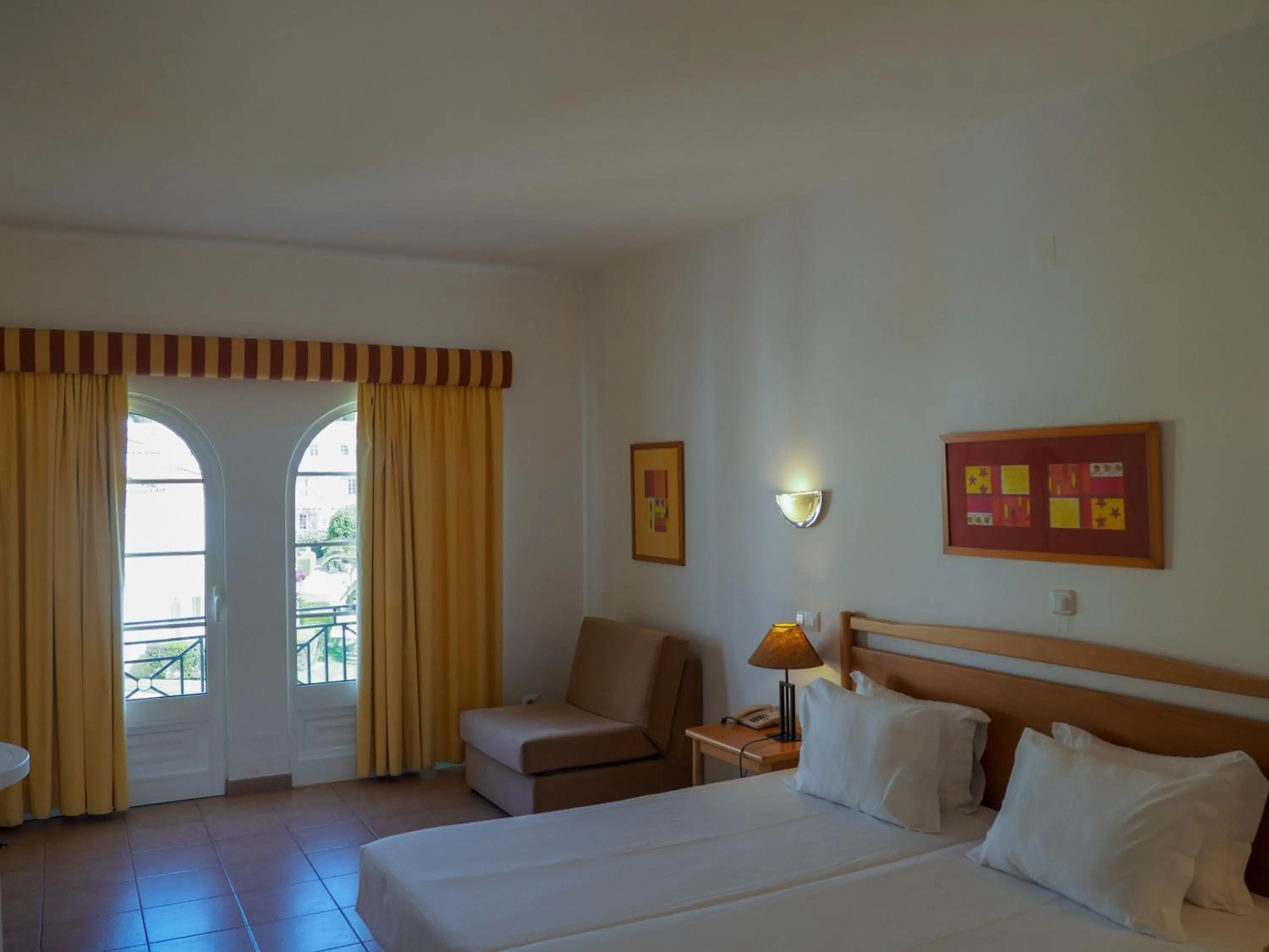 Bed in Luz Bay Hotel