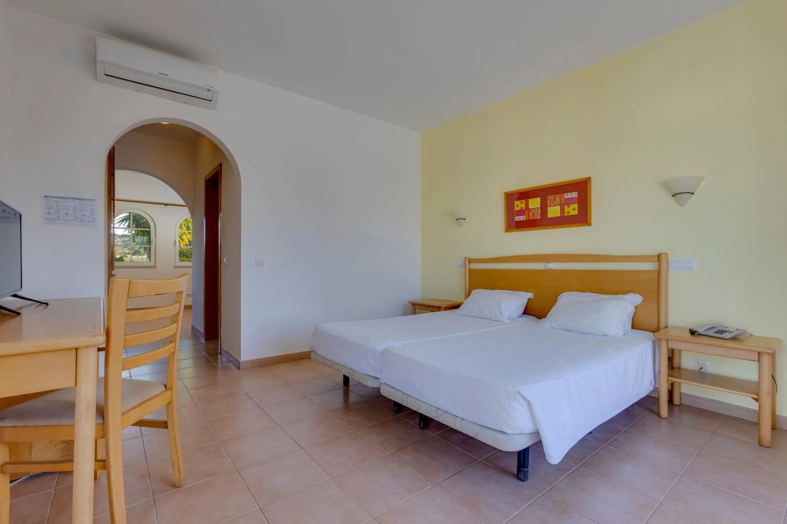 Bed in Luz Bay Hotel