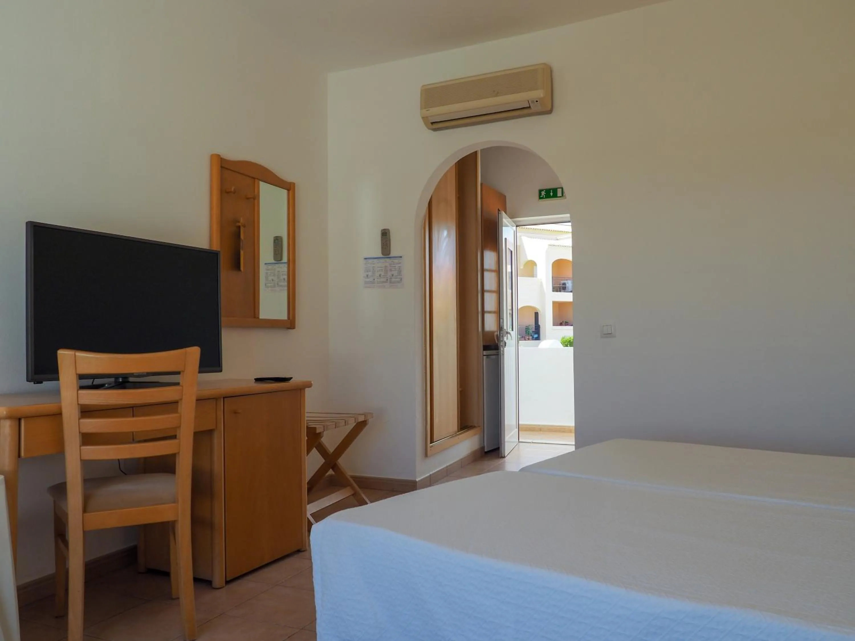 Bed in Luz Bay Hotel