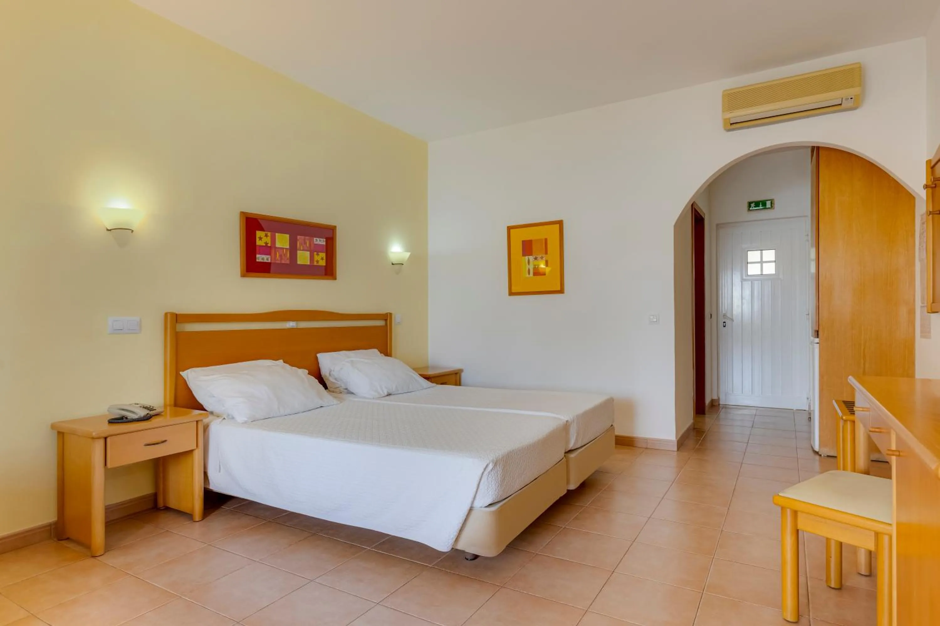 Bed in Luz Bay Hotel