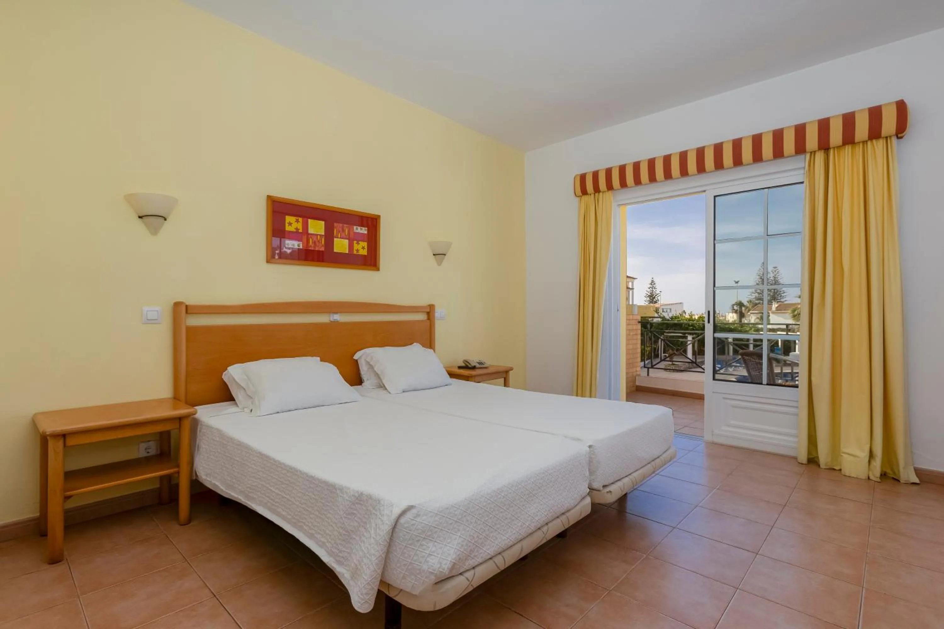 Bed in Luz Bay Hotel