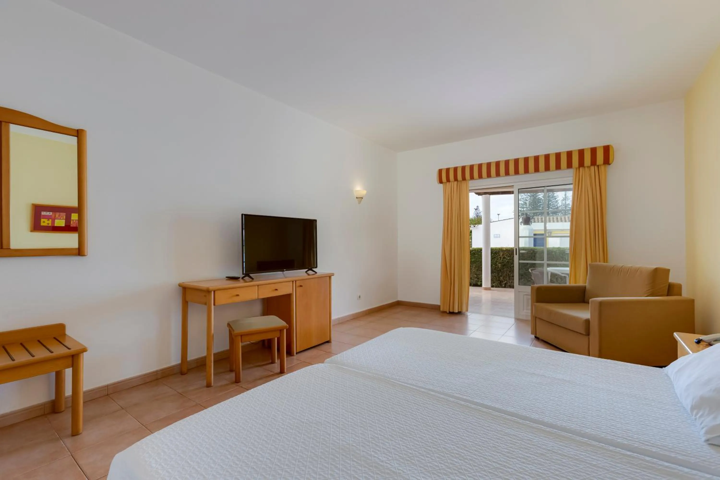 Bed in Luz Bay Hotel