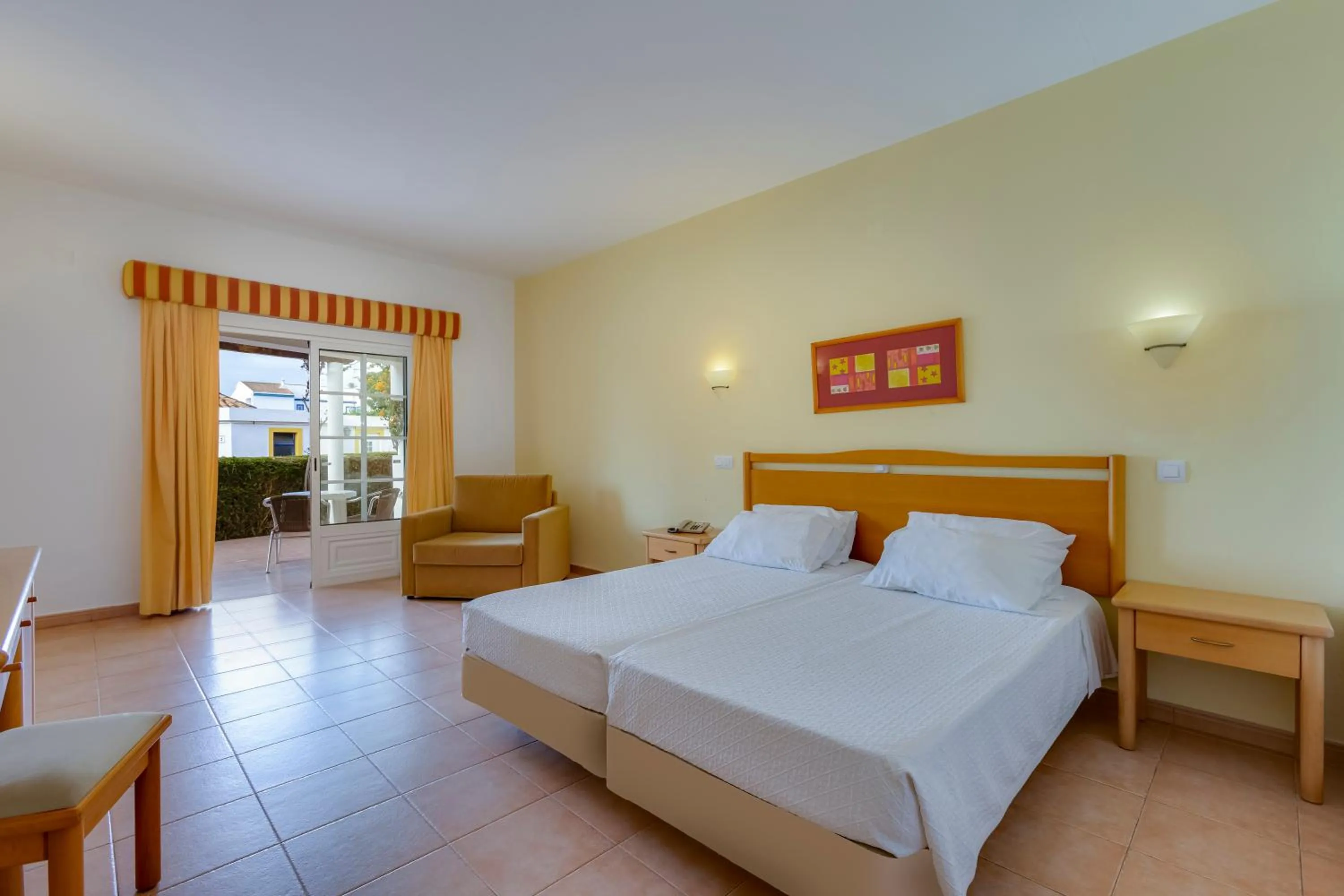 Bed in Luz Bay Hotel