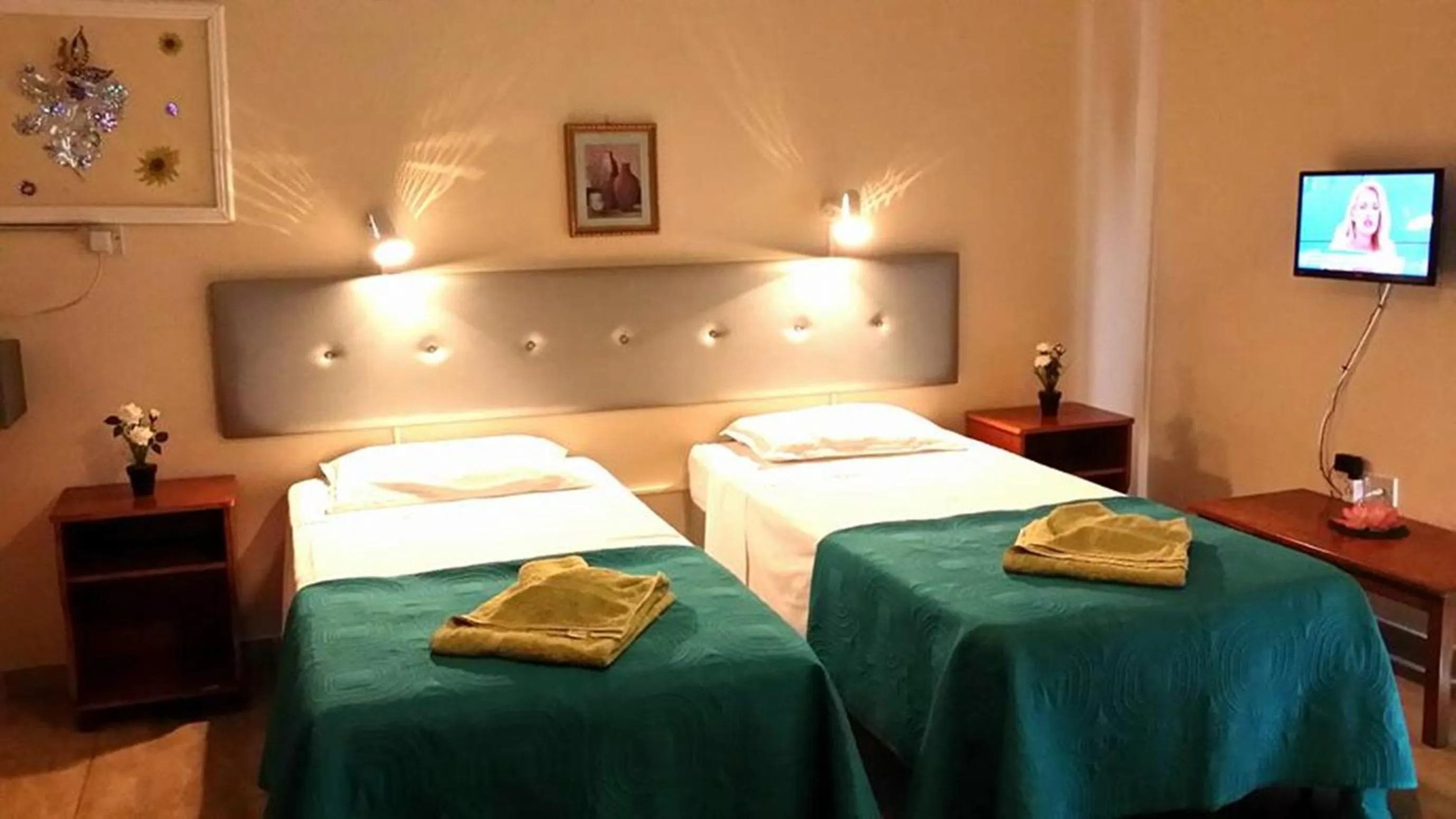 Bed in Florence Hotel Apartments