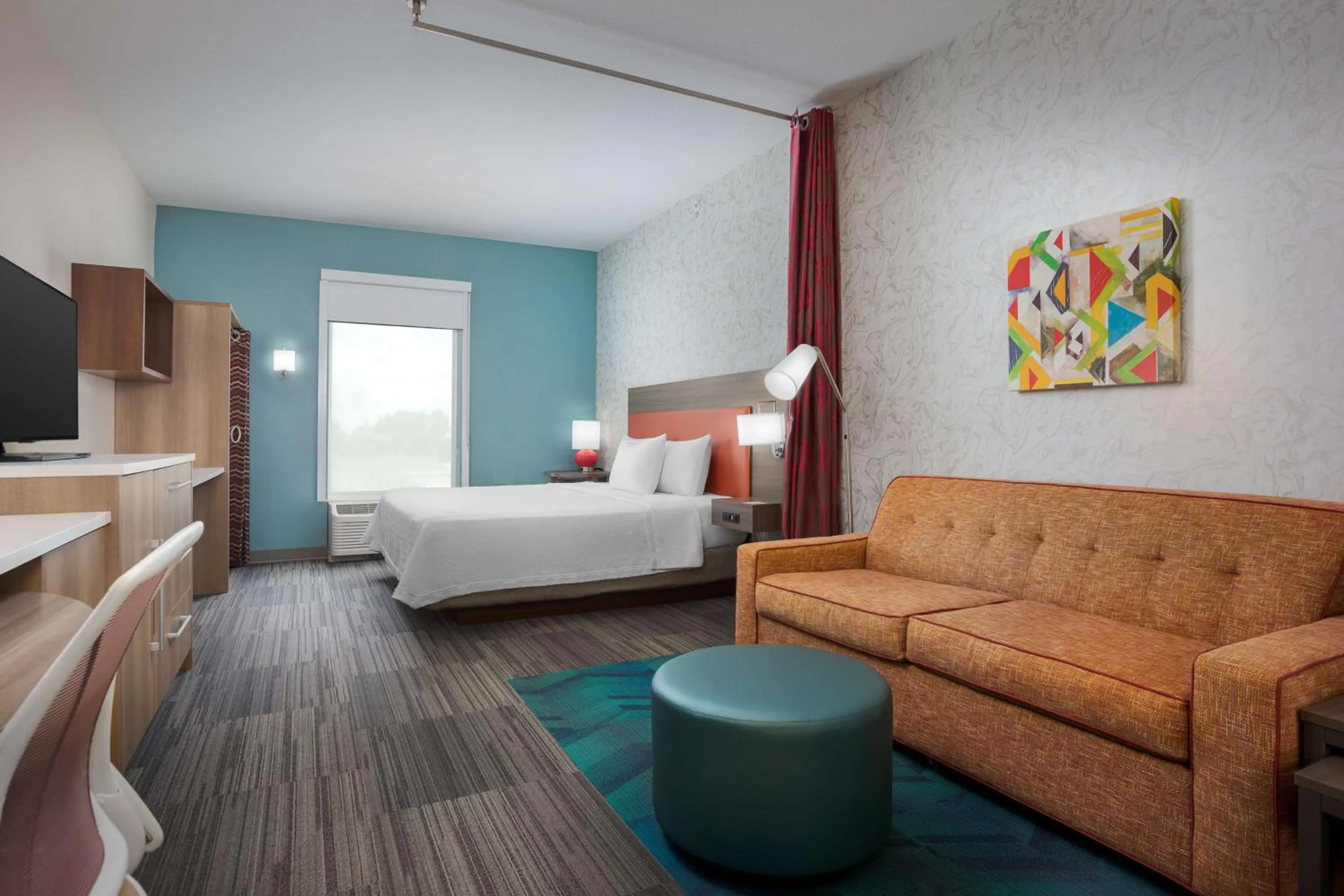 Living room, Bed in Home2 Suites By Hilton Clermont