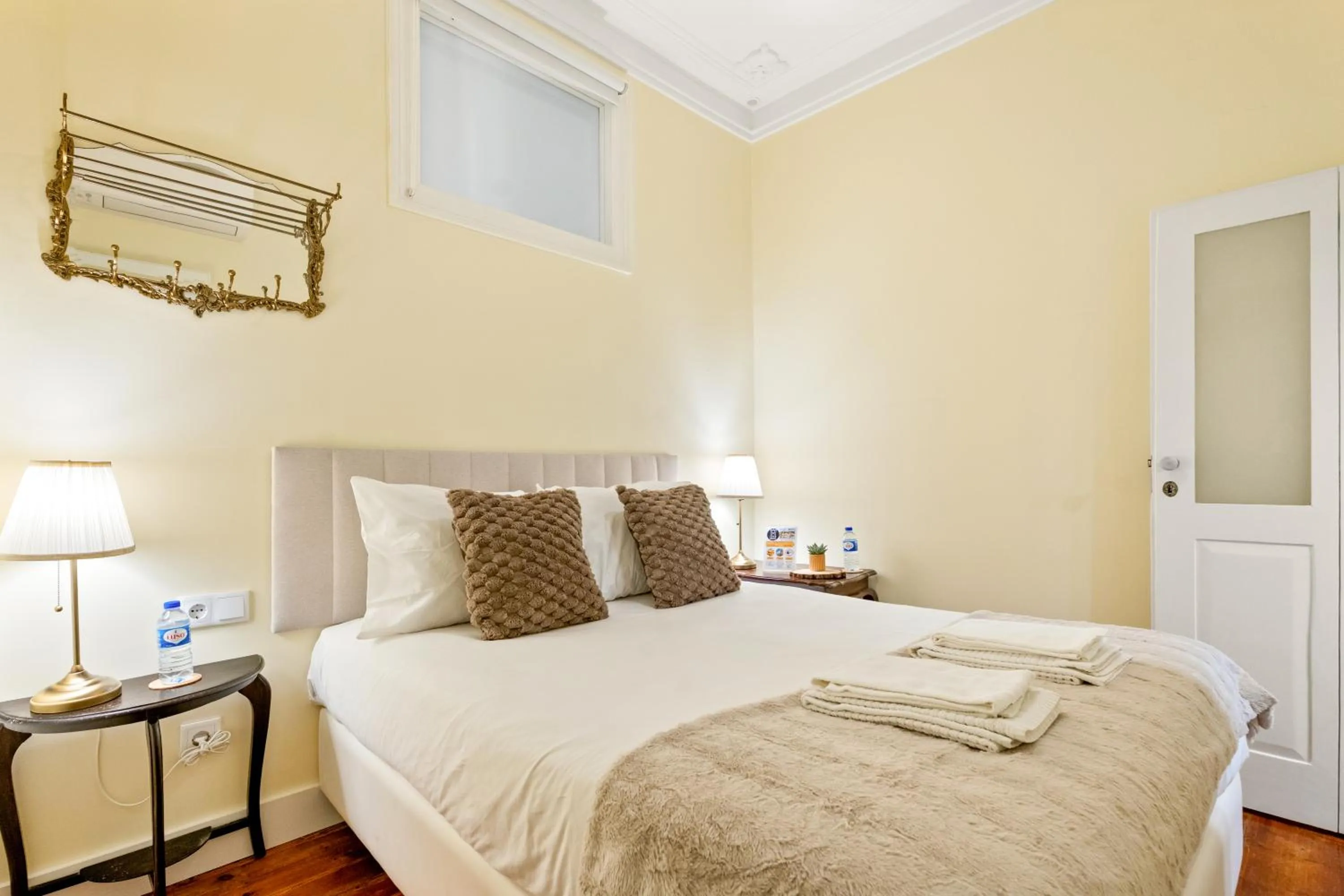 Bed in 1898 Home & Suites