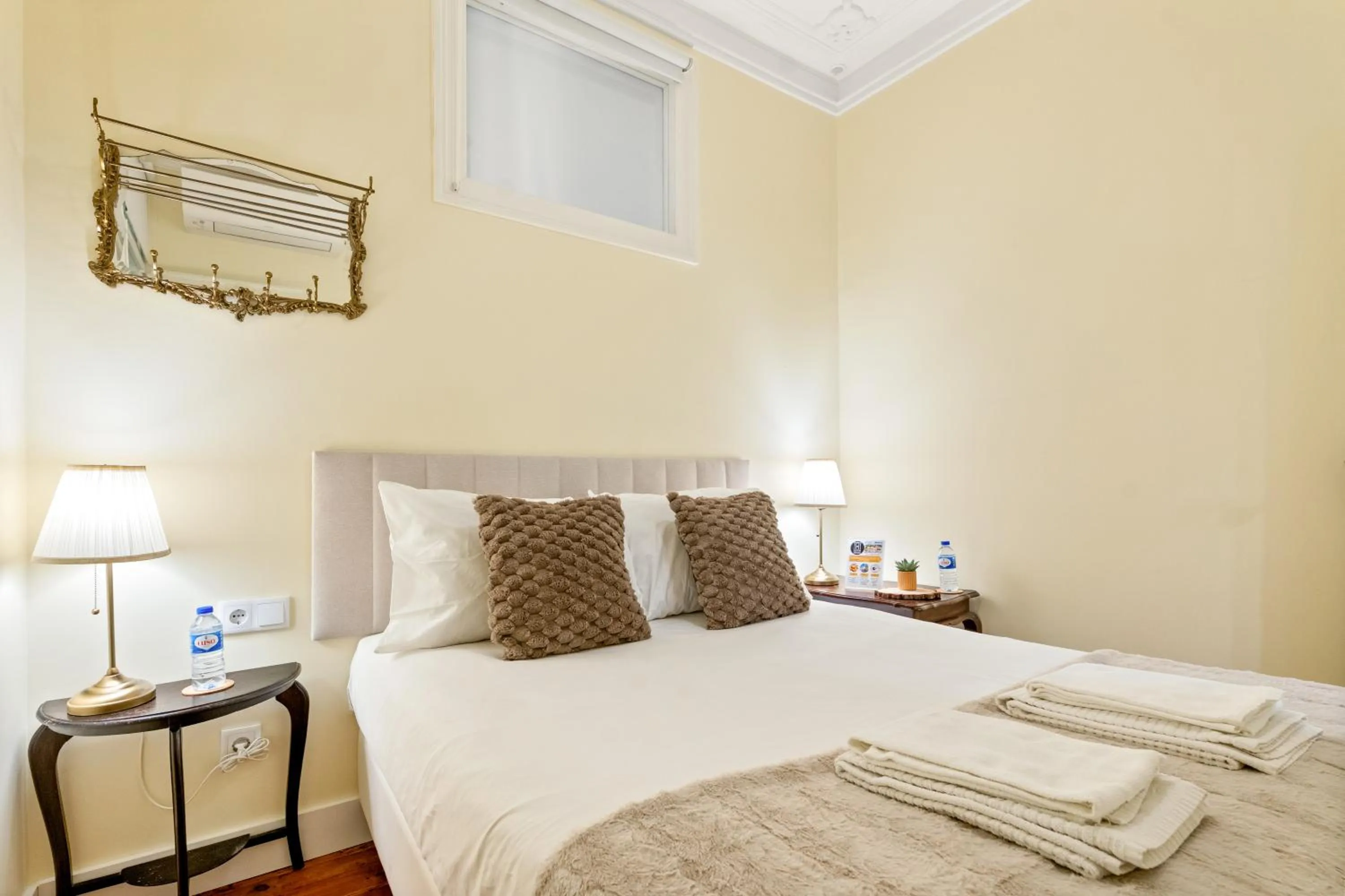 Bed in 1898 Home & Suites