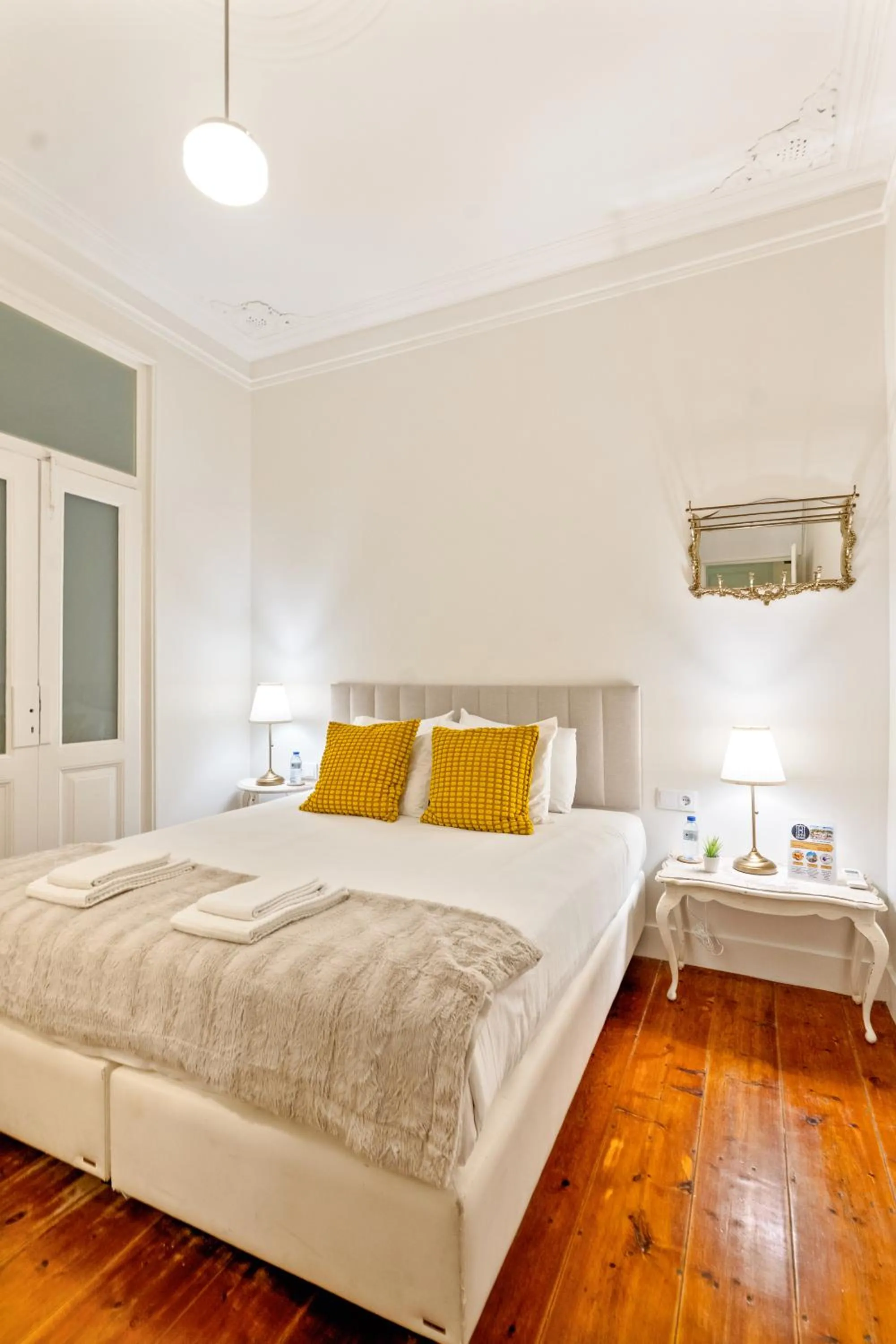 Bed in 1898 Home & Suites