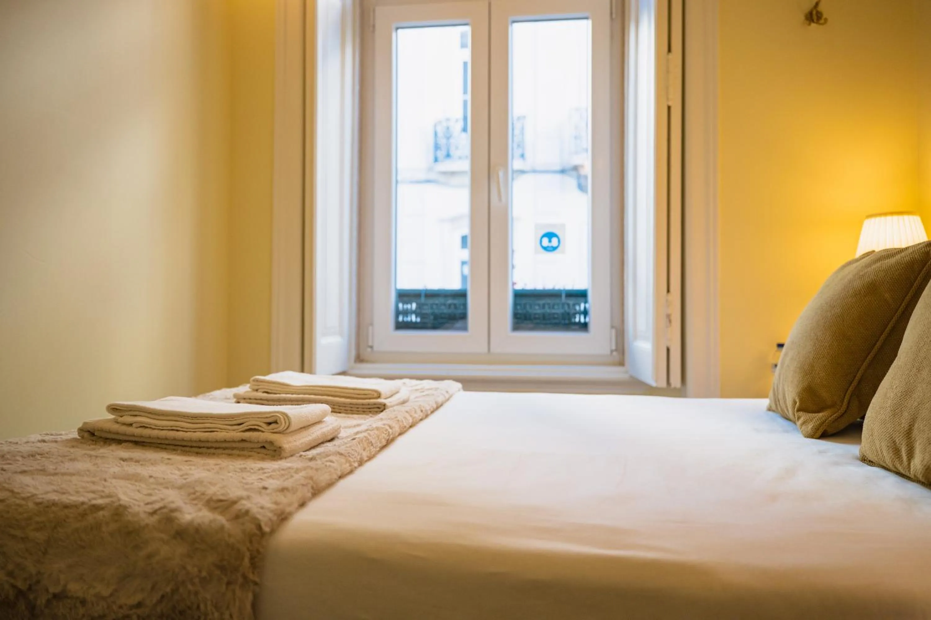 Bed in 1898 Home & Suites