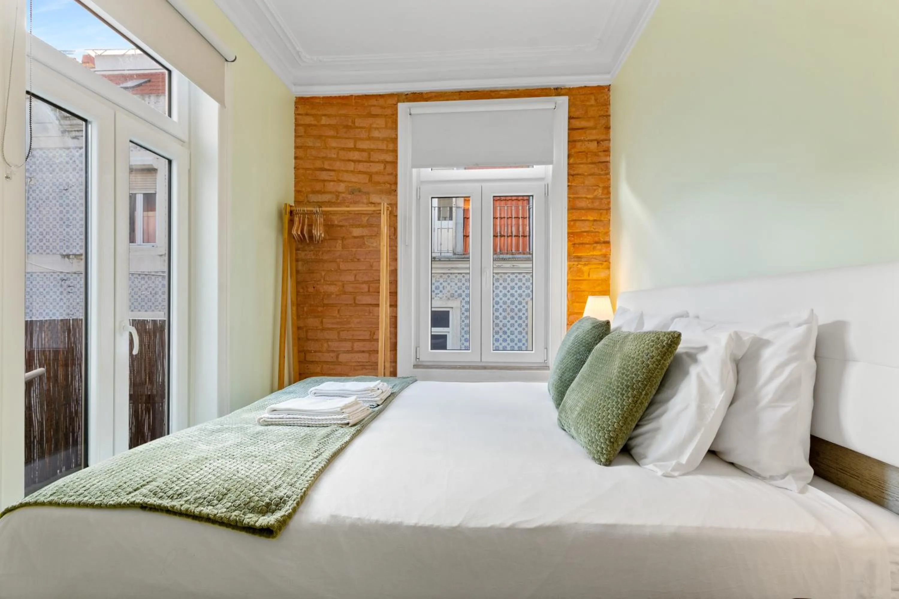 Bed in 1898 Home & Suites