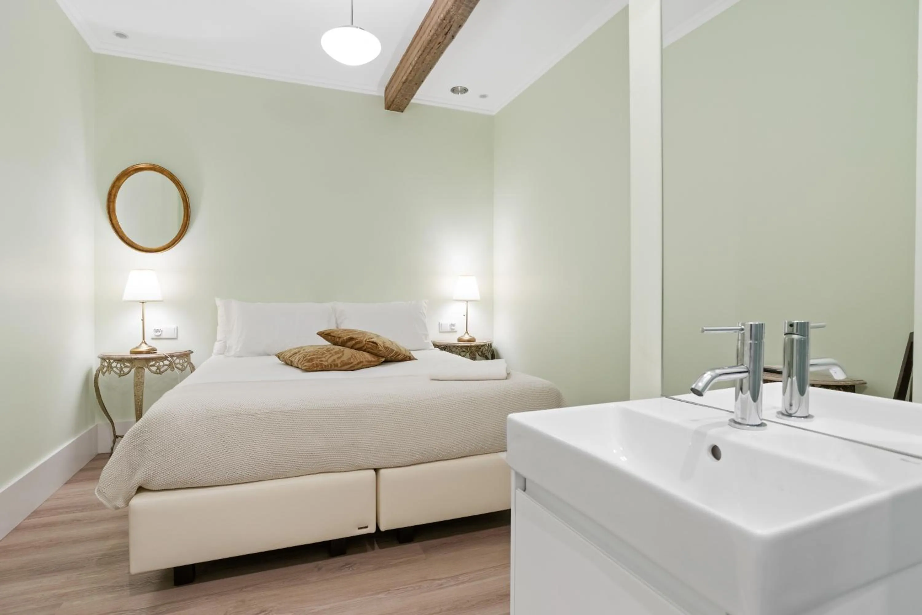 Bed in 1898 Home & Suites