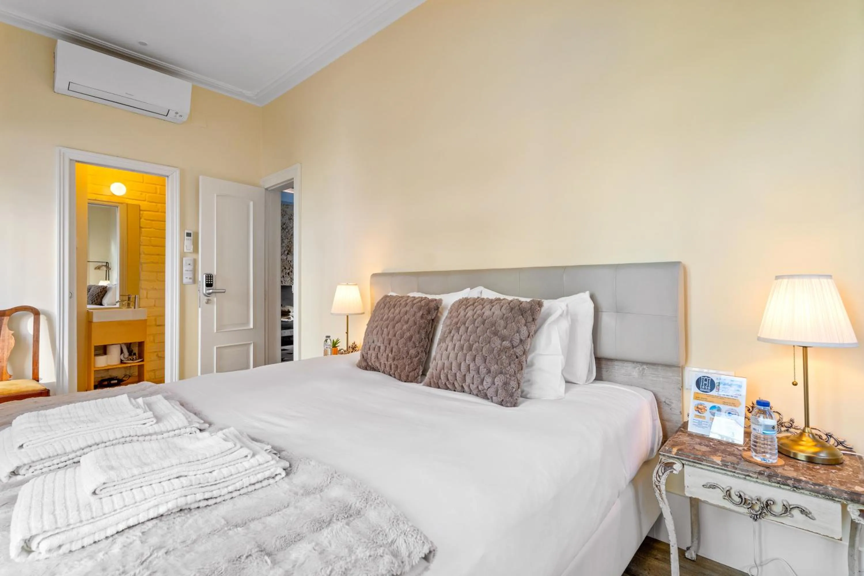 Bed in 1898 Home & Suites