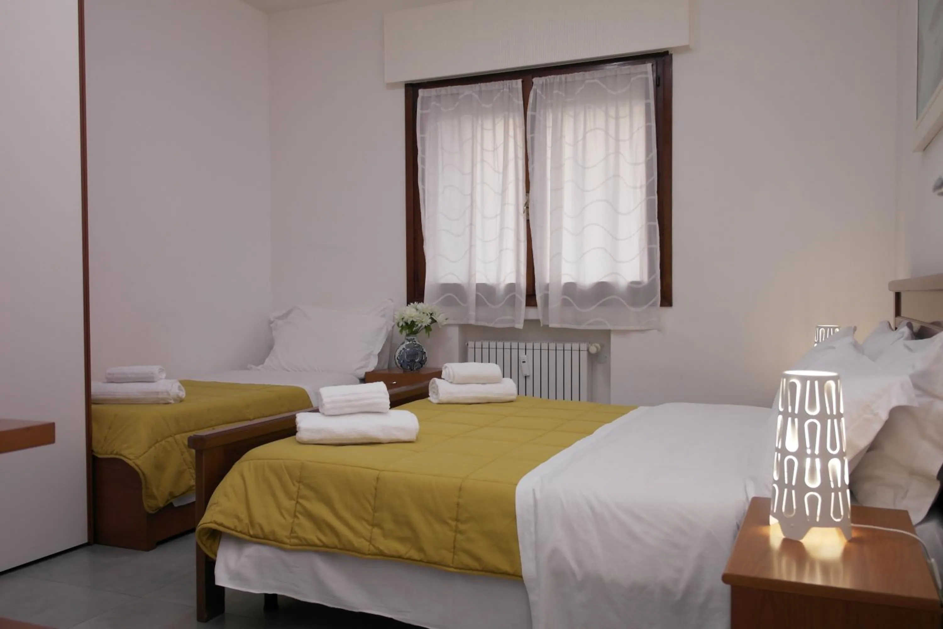 Bed in Rosa Garden B&B