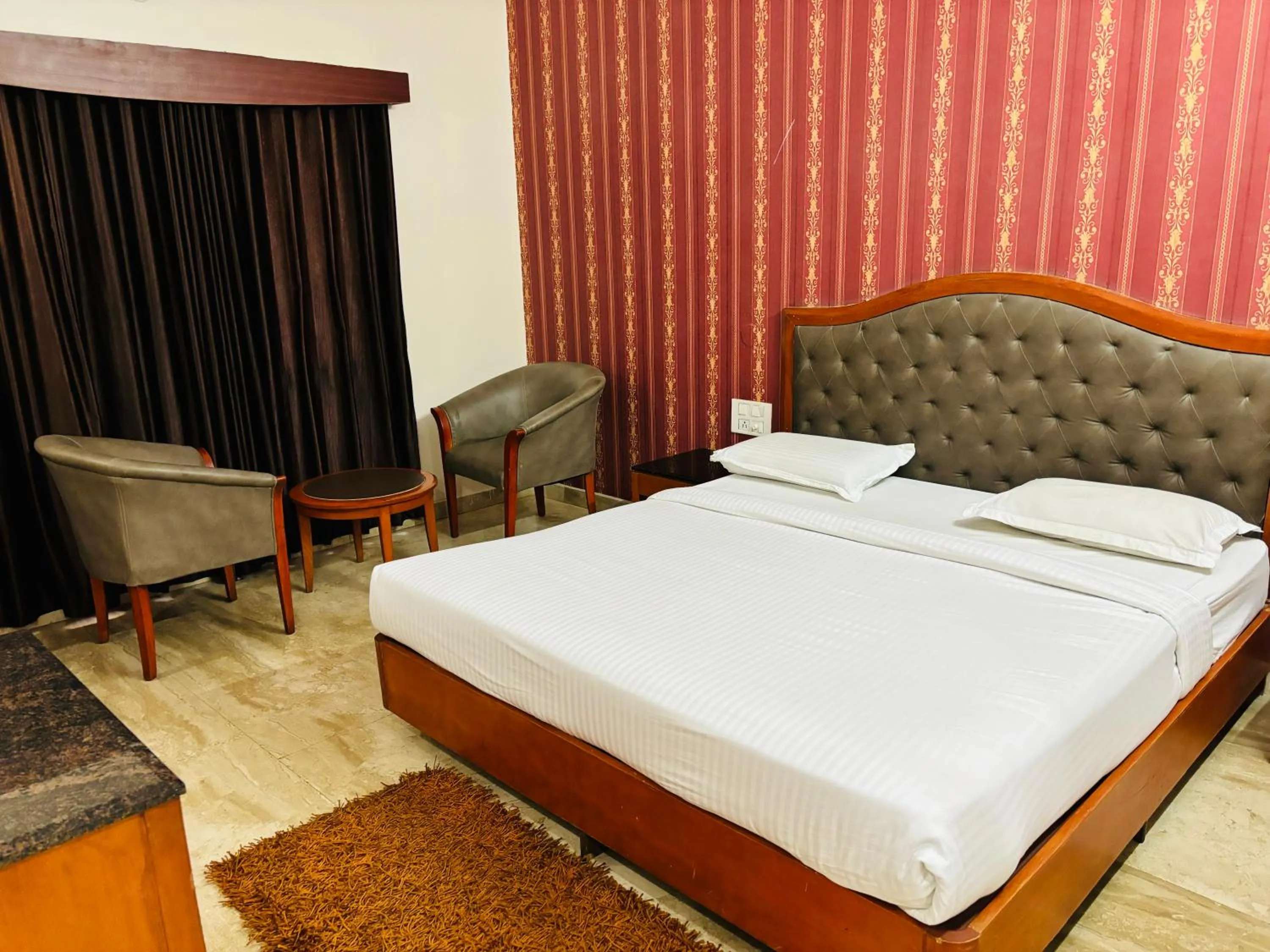 Bed in Hotel Chetan International