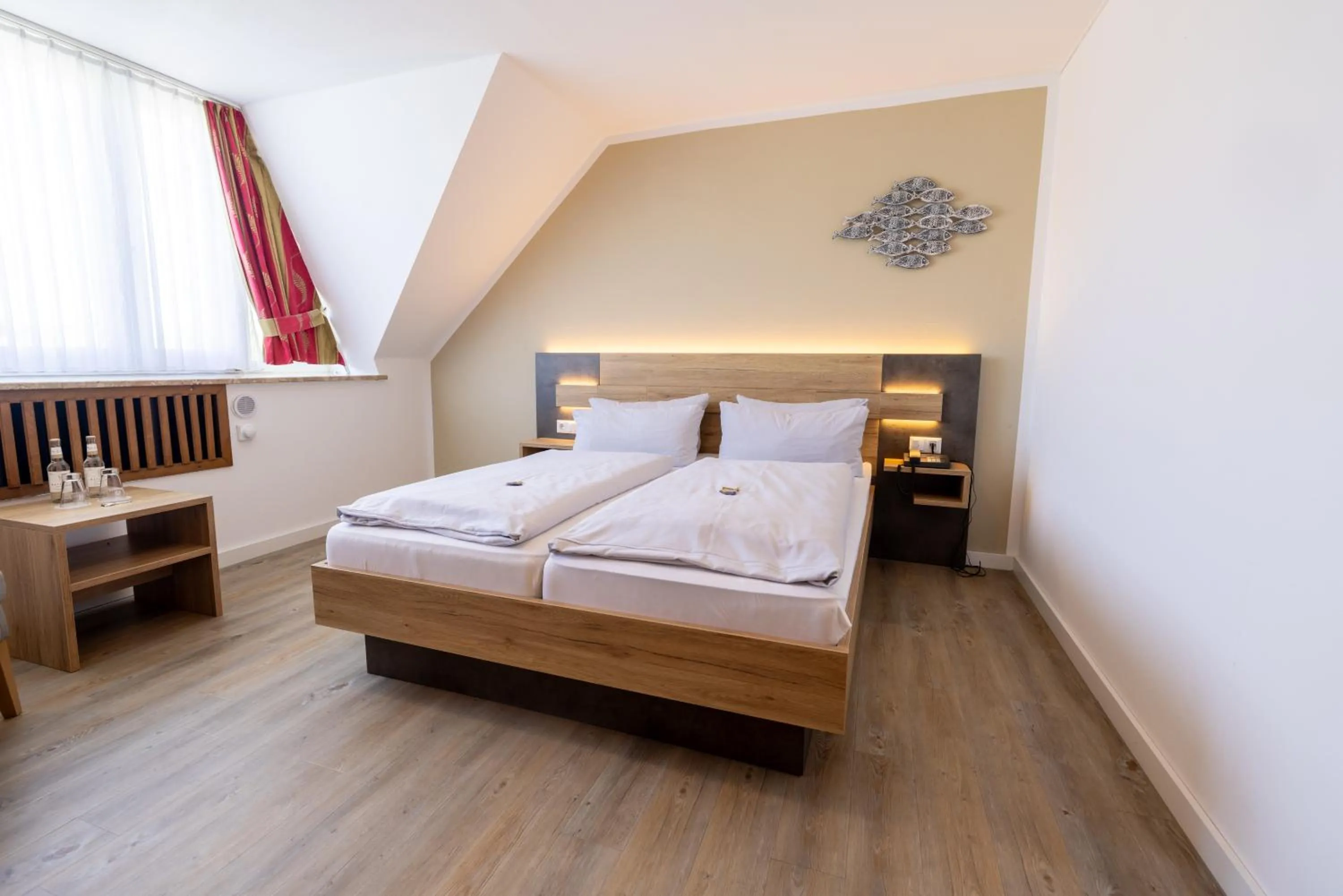 Photo of the whole room, Bed in Hotel Lüttje Burg