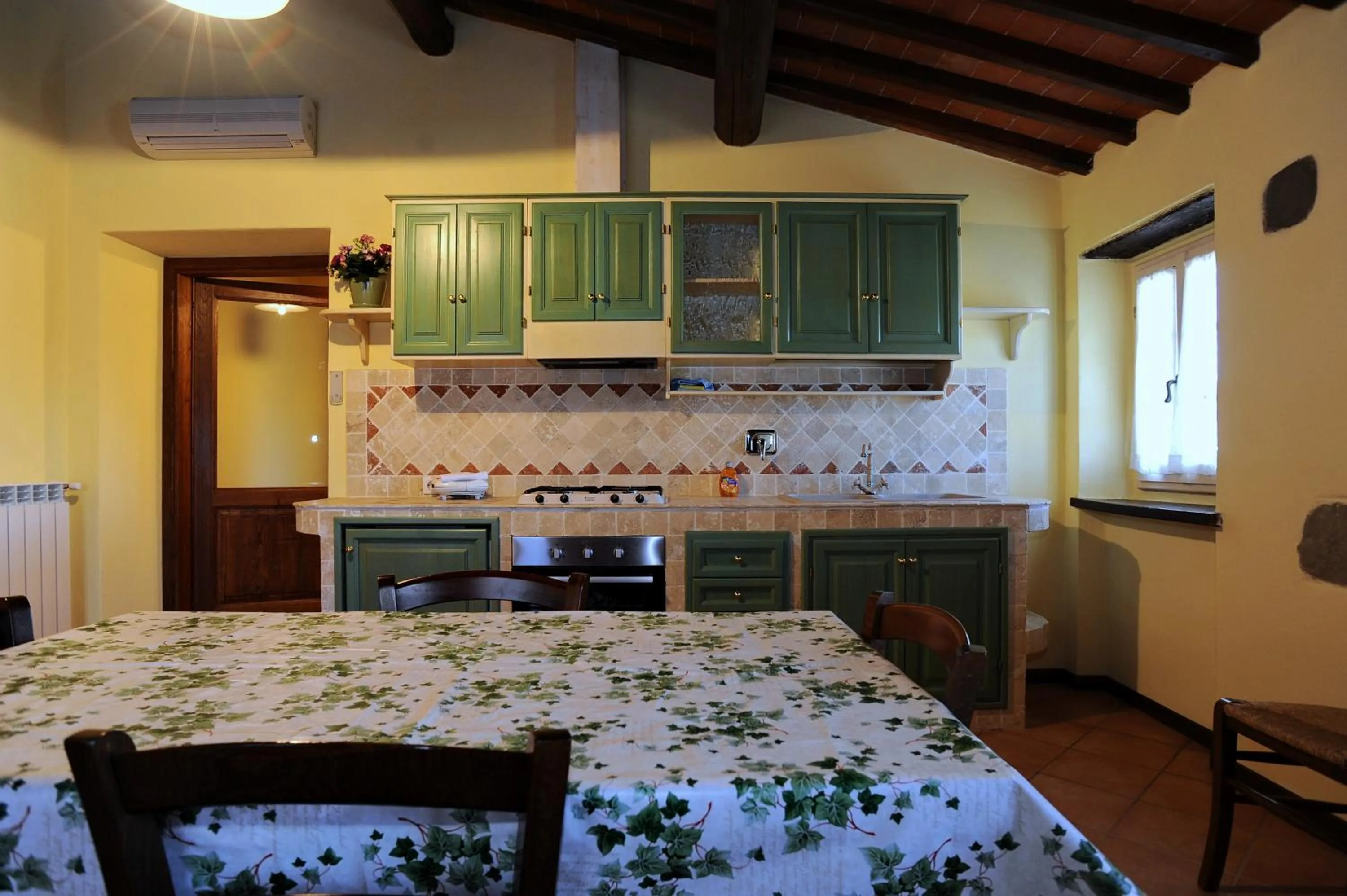 Kitchen or kitchenette, Bed in Borgo di Erboli