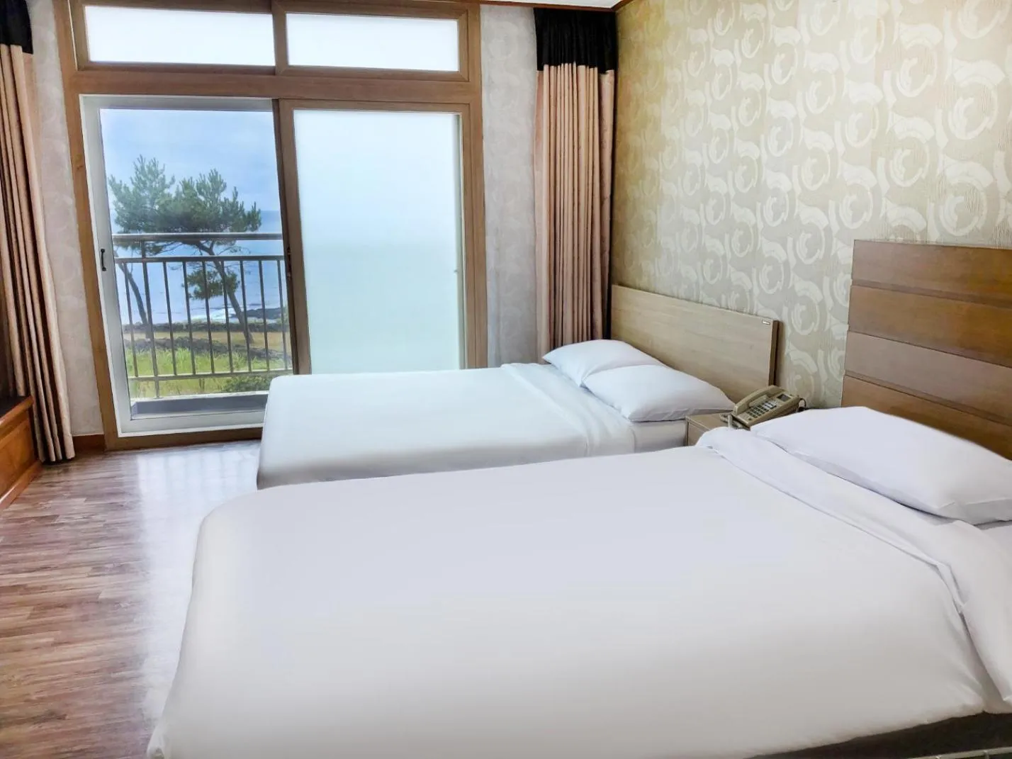 Bed in Jeju Ilsung Beach Condo