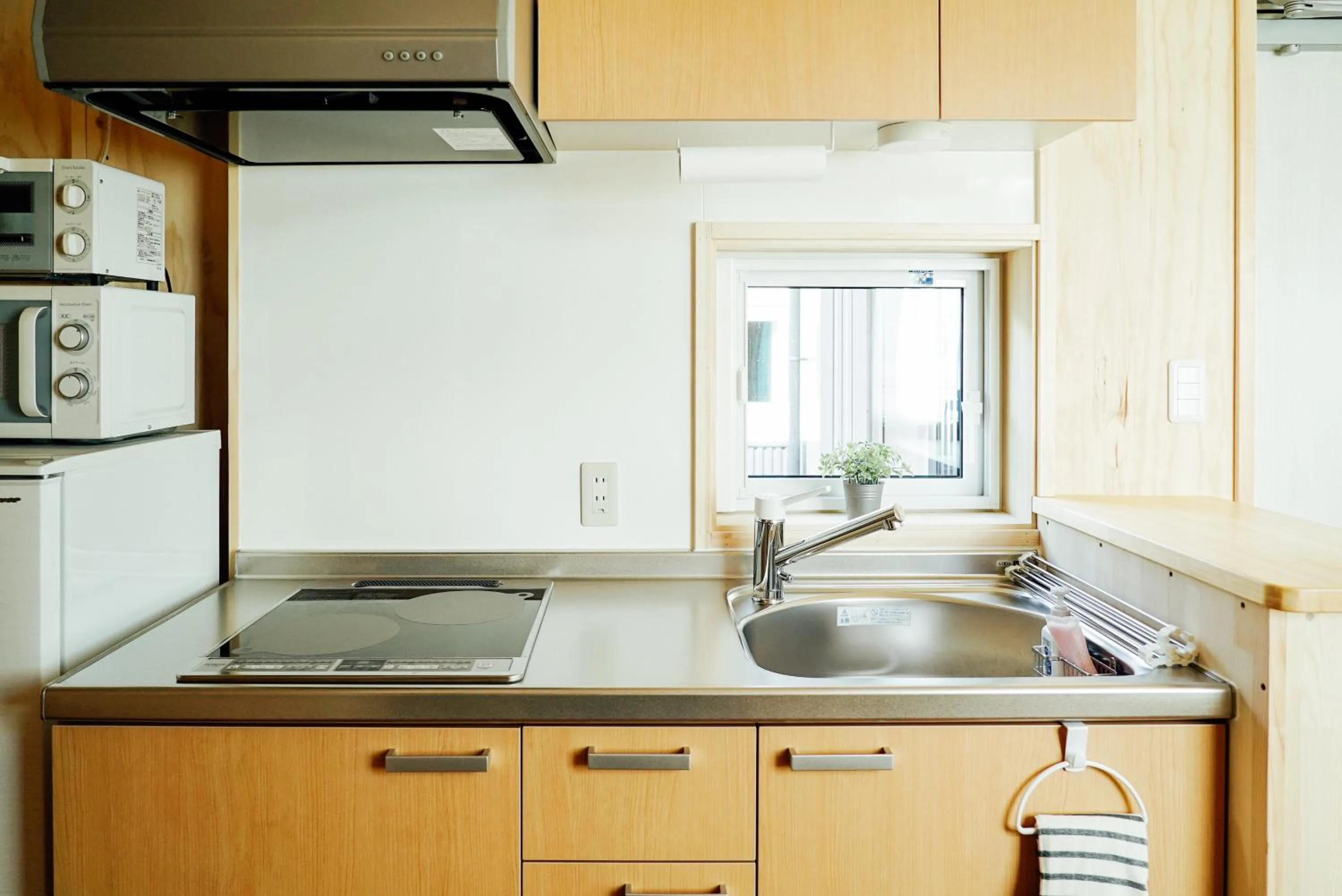 Kitchen or kitchenette in Jstyle STAY Furano