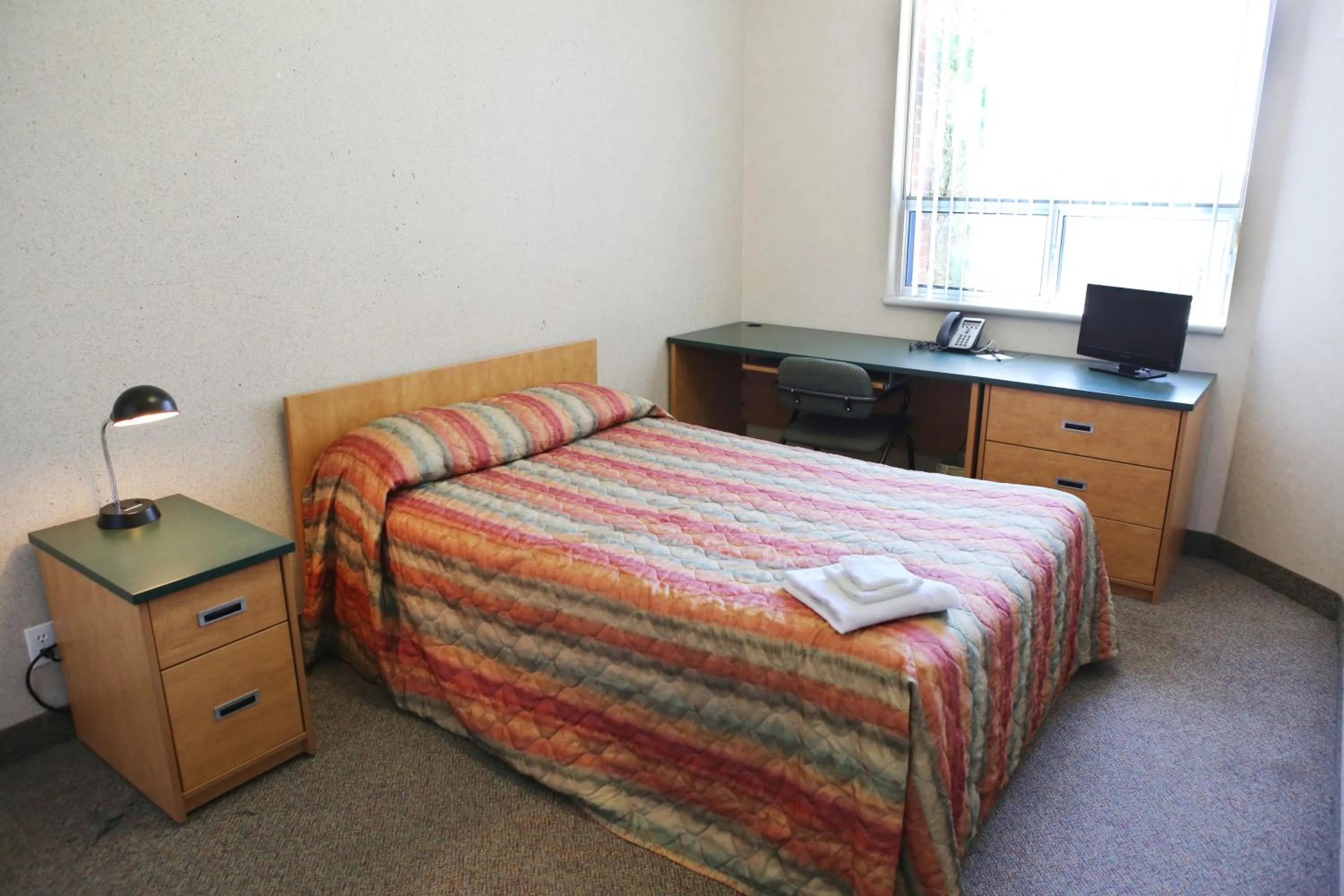 Photo of the whole room, Bed in Residence & Conference Centre- Barrie