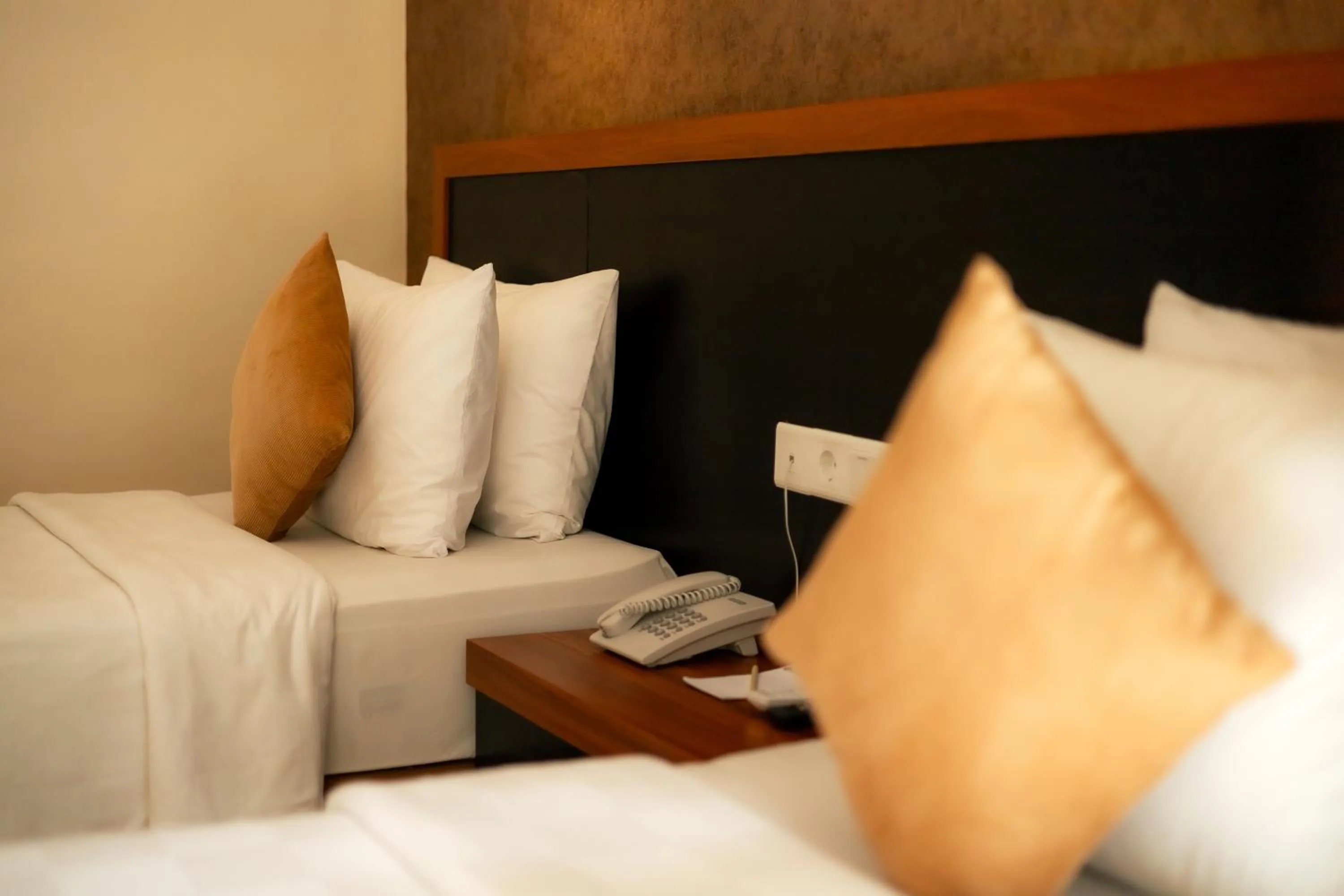 Bed in Fourteen Roses Beach Hotel