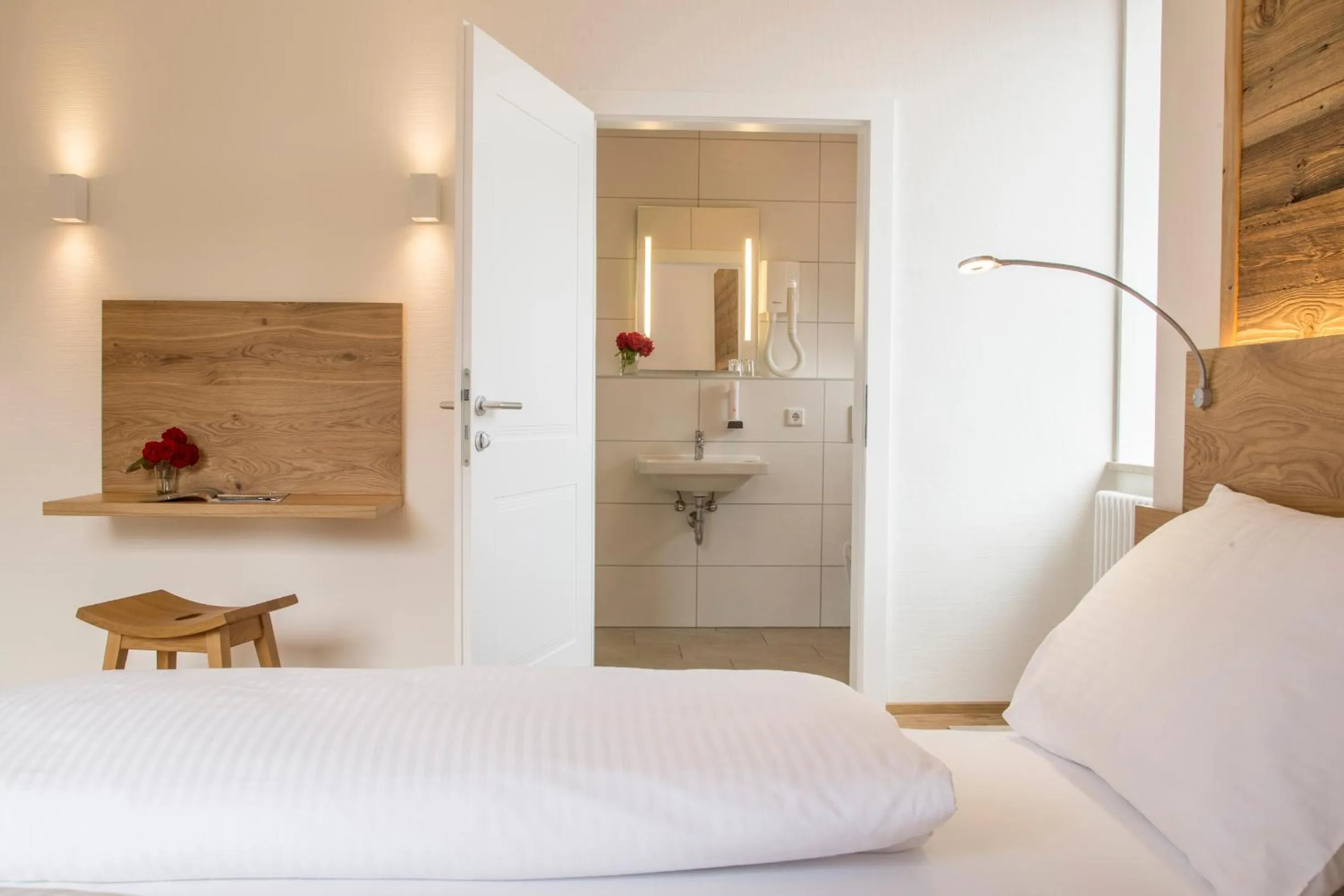 Bathroom, Bed in Hotel Vötterl