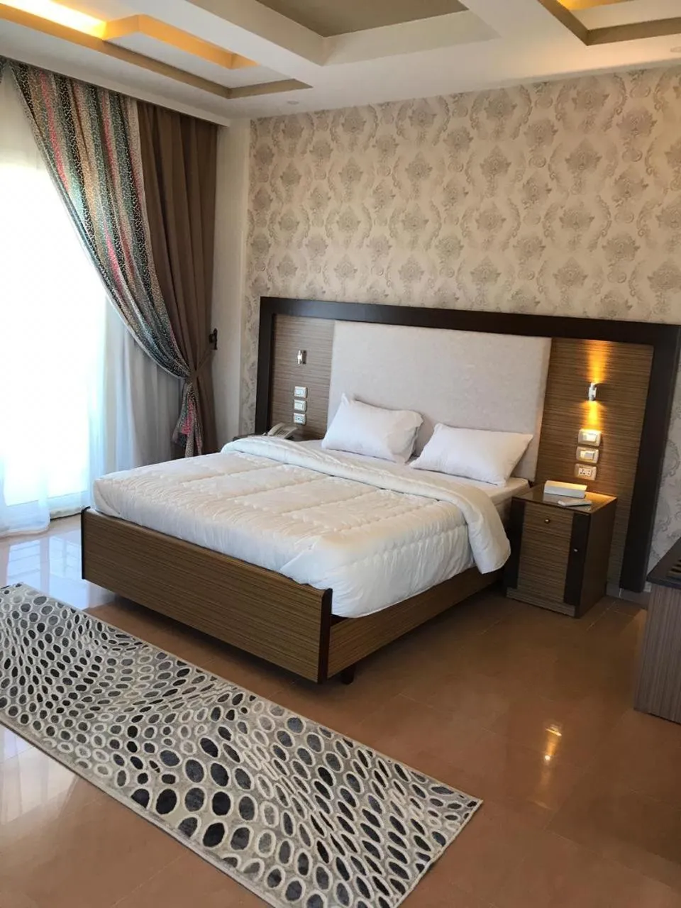 Bed in Dolphin Ras El-Bar Hotel