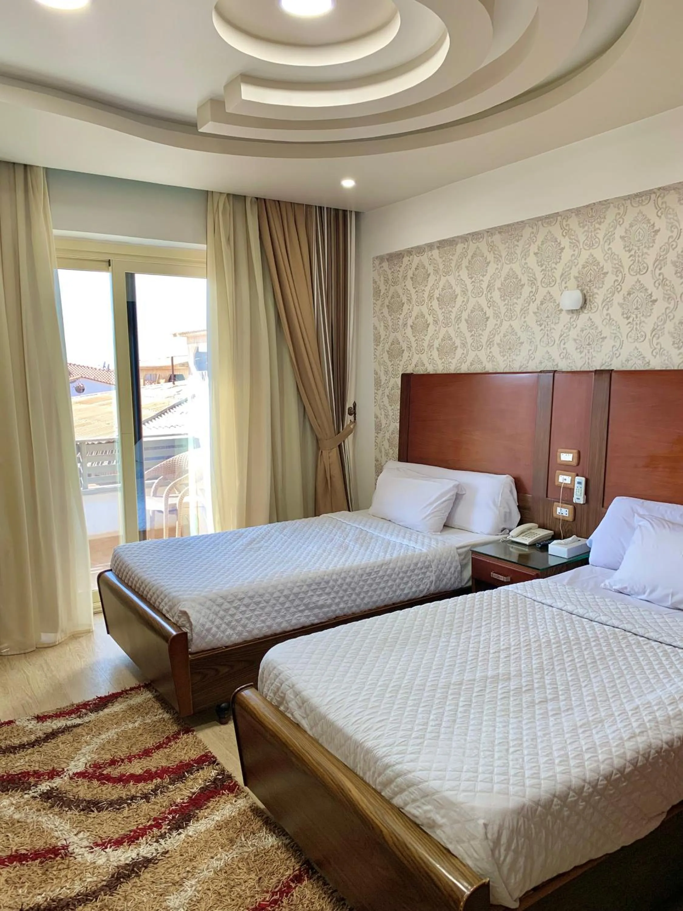 Bed in Dolphin Ras El-Bar Hotel