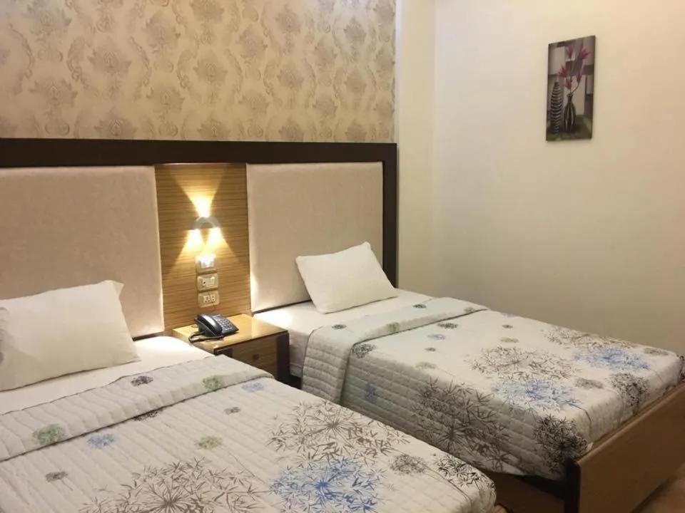 Bed in Dolphin Ras El-Bar Hotel