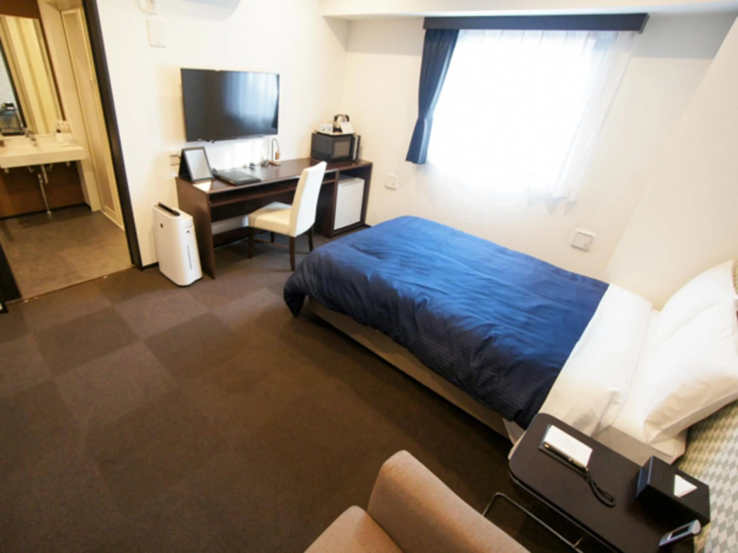 Bed in HOTEL LiVEMAX Minamihashimoto Ekimae