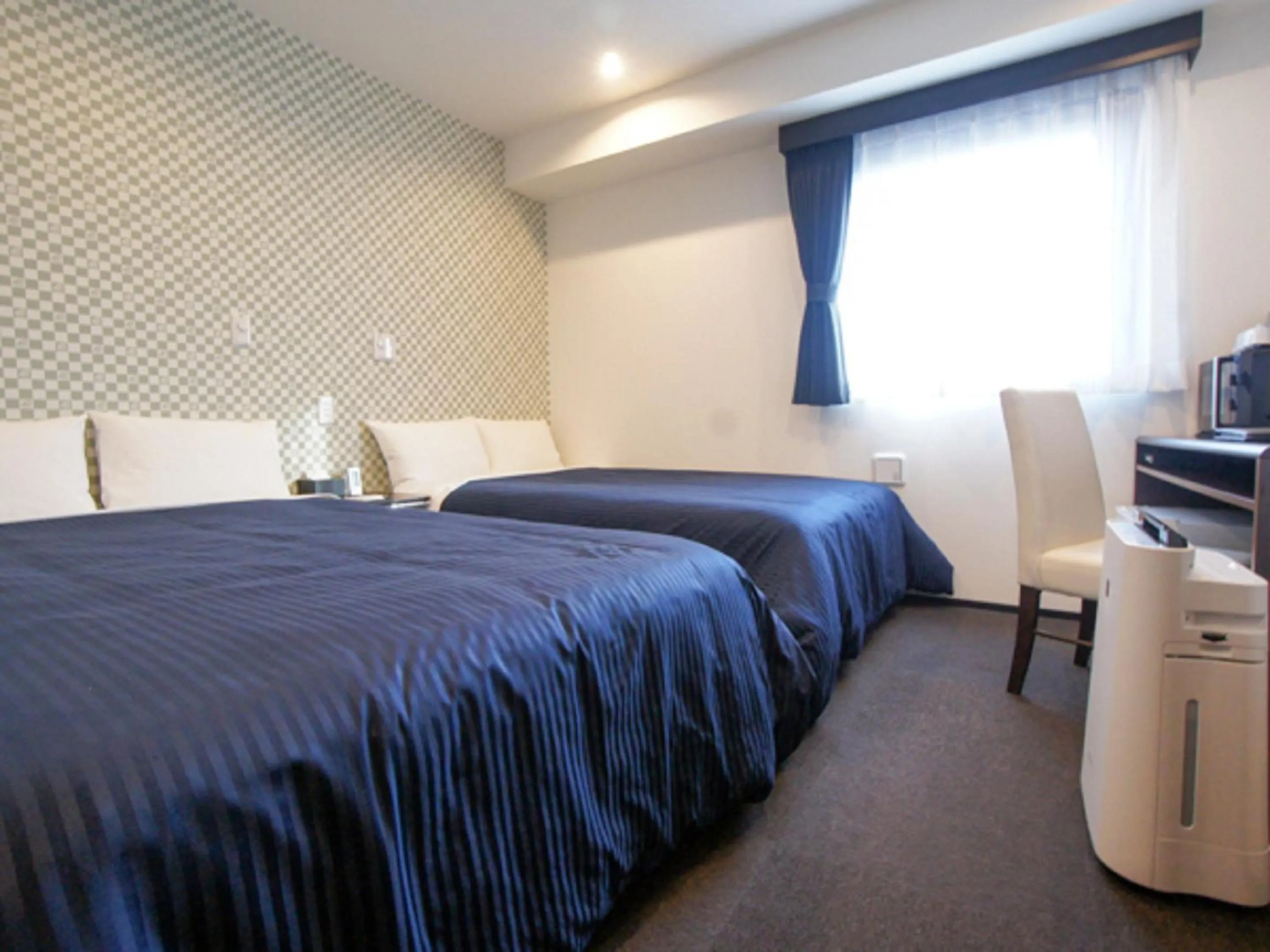 Bed in HOTEL LiVEMAX Minamihashimoto Ekimae