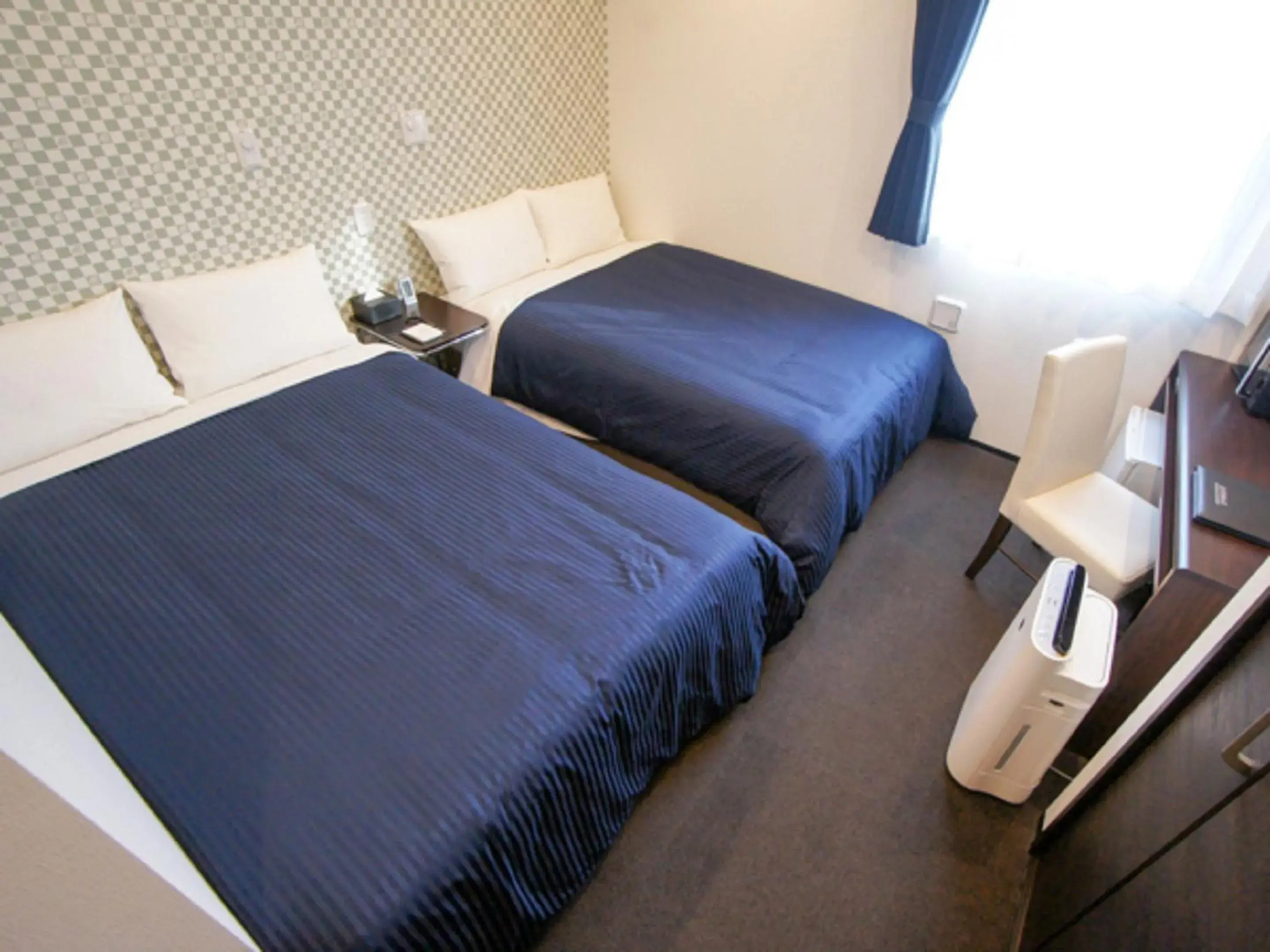 Bed in HOTEL LiVEMAX Minamihashimoto Ekimae Bed in HOTEL LiVEMAX Minamihashimoto Ekimae