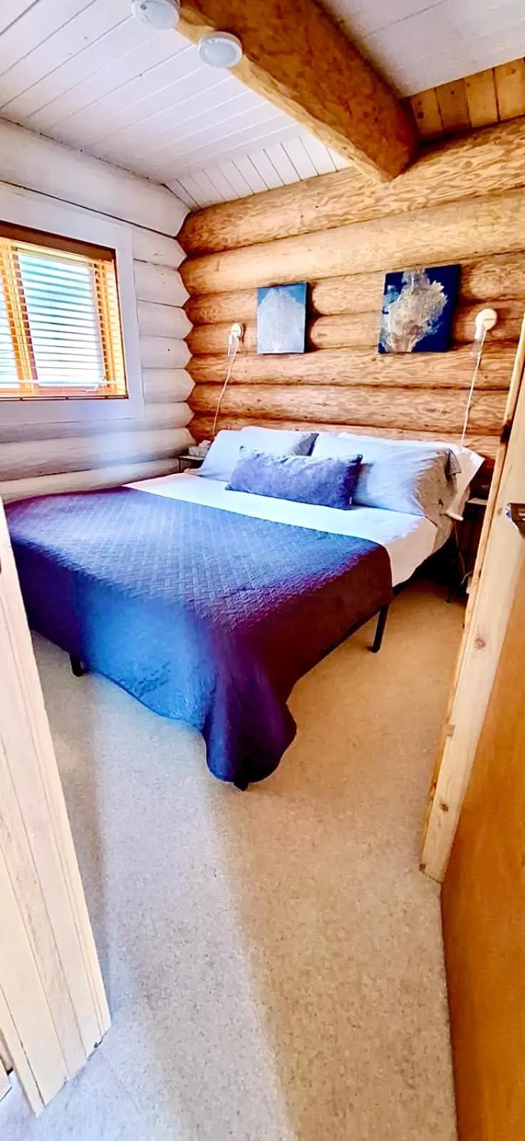 Bed in The Beach House Texada - Oceanfront Cabin