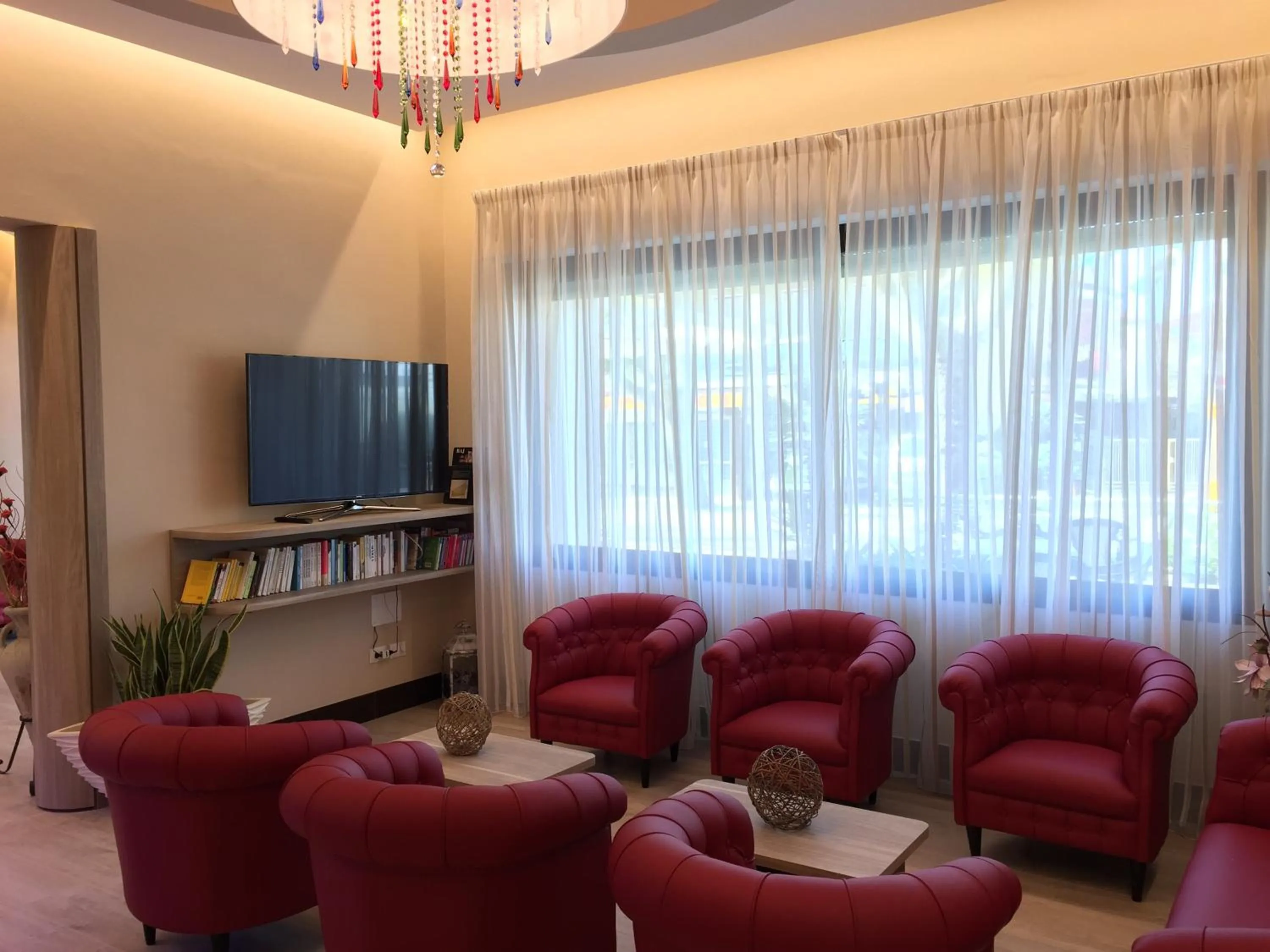 Communal lounge/ TV room in Hotel Amico